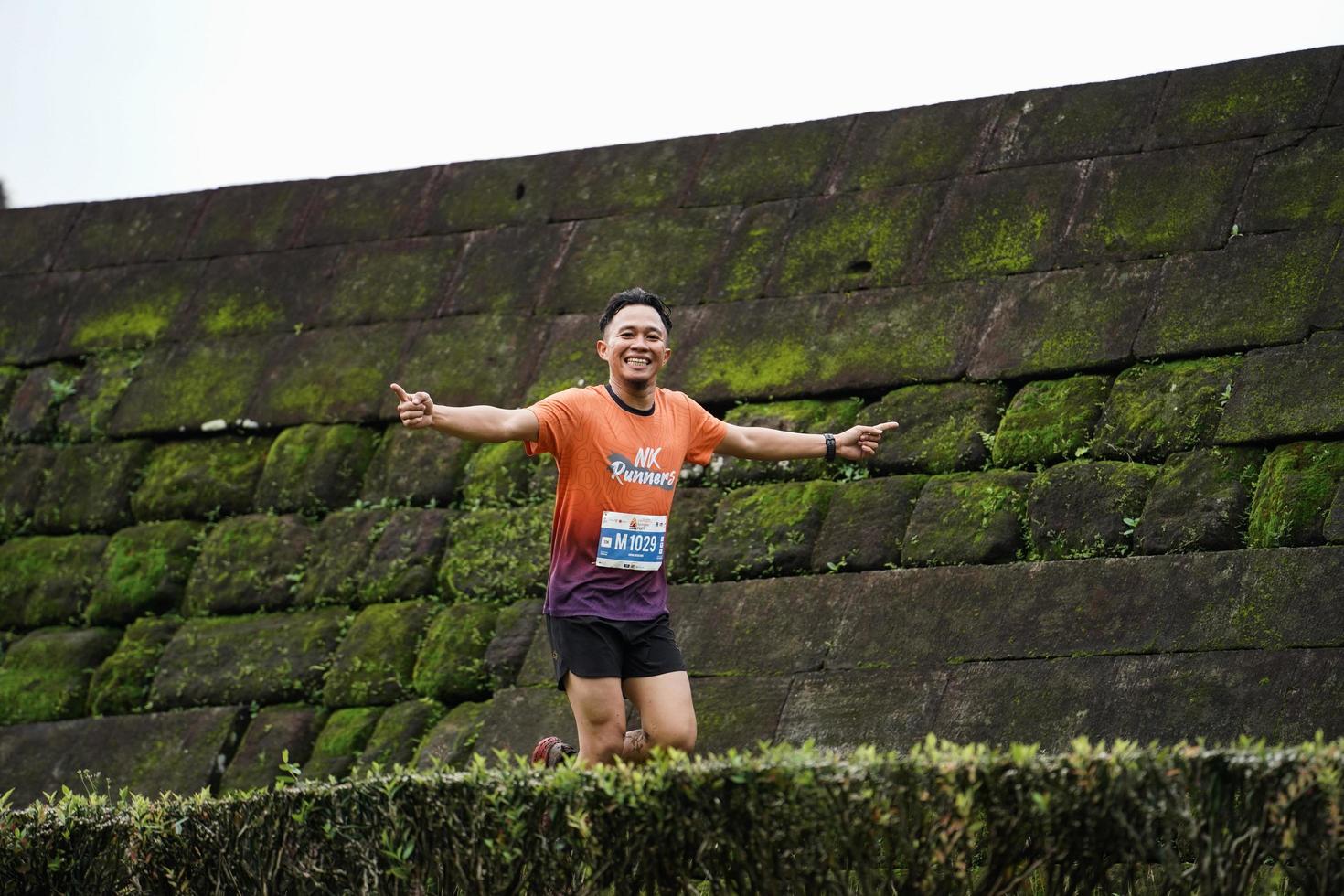 Yogyakarta, Indonesia - November 20, 2022 The Sleman Temple Run contingent passed the scenic route of the Barong temple, they took part in a trail running contest. photo