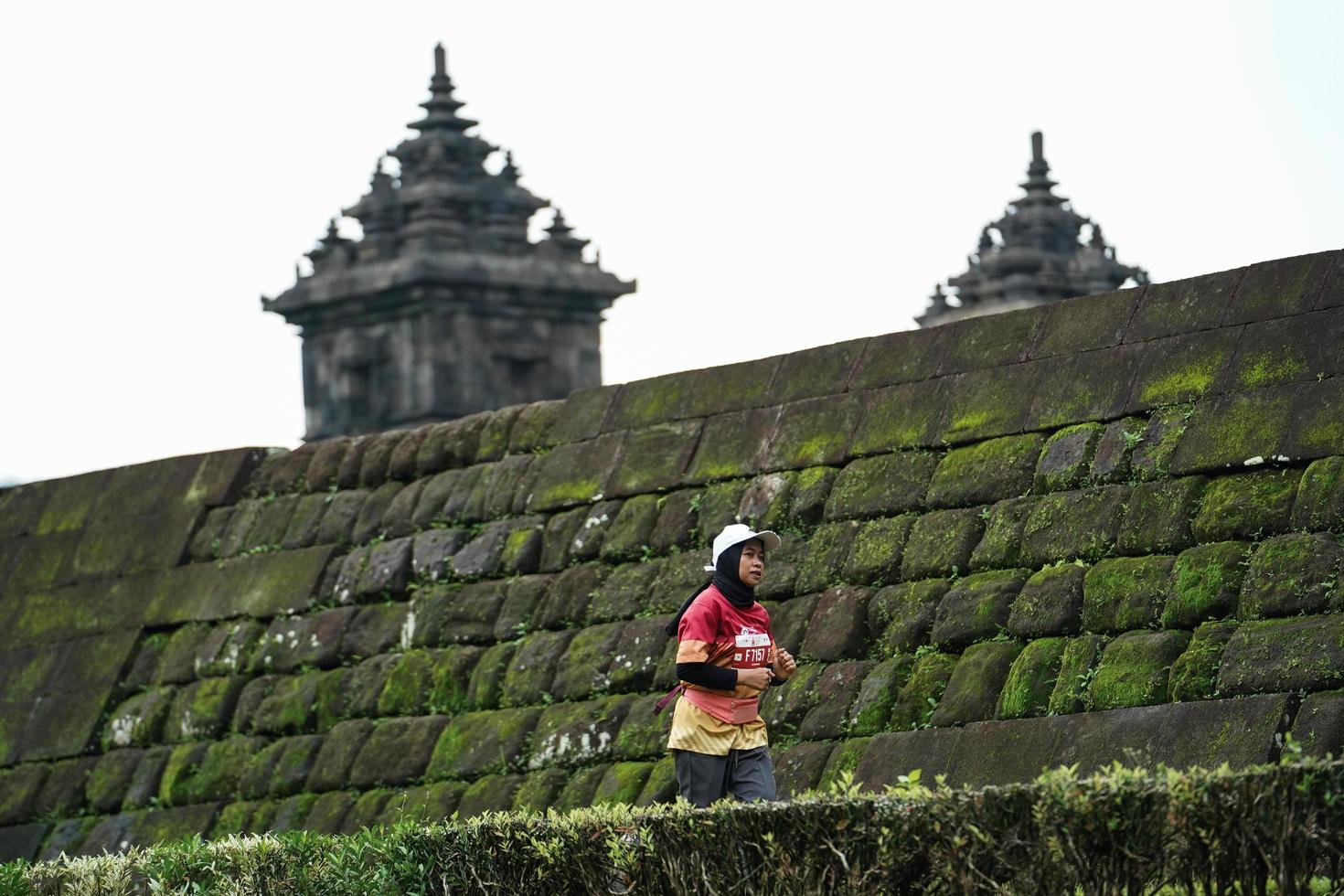 Yogyakarta, Indonesia - November 20, 2022 The Sleman Temple Run contingent passed the scenic route of the Barong temple, they took part in a trail running contest. photo