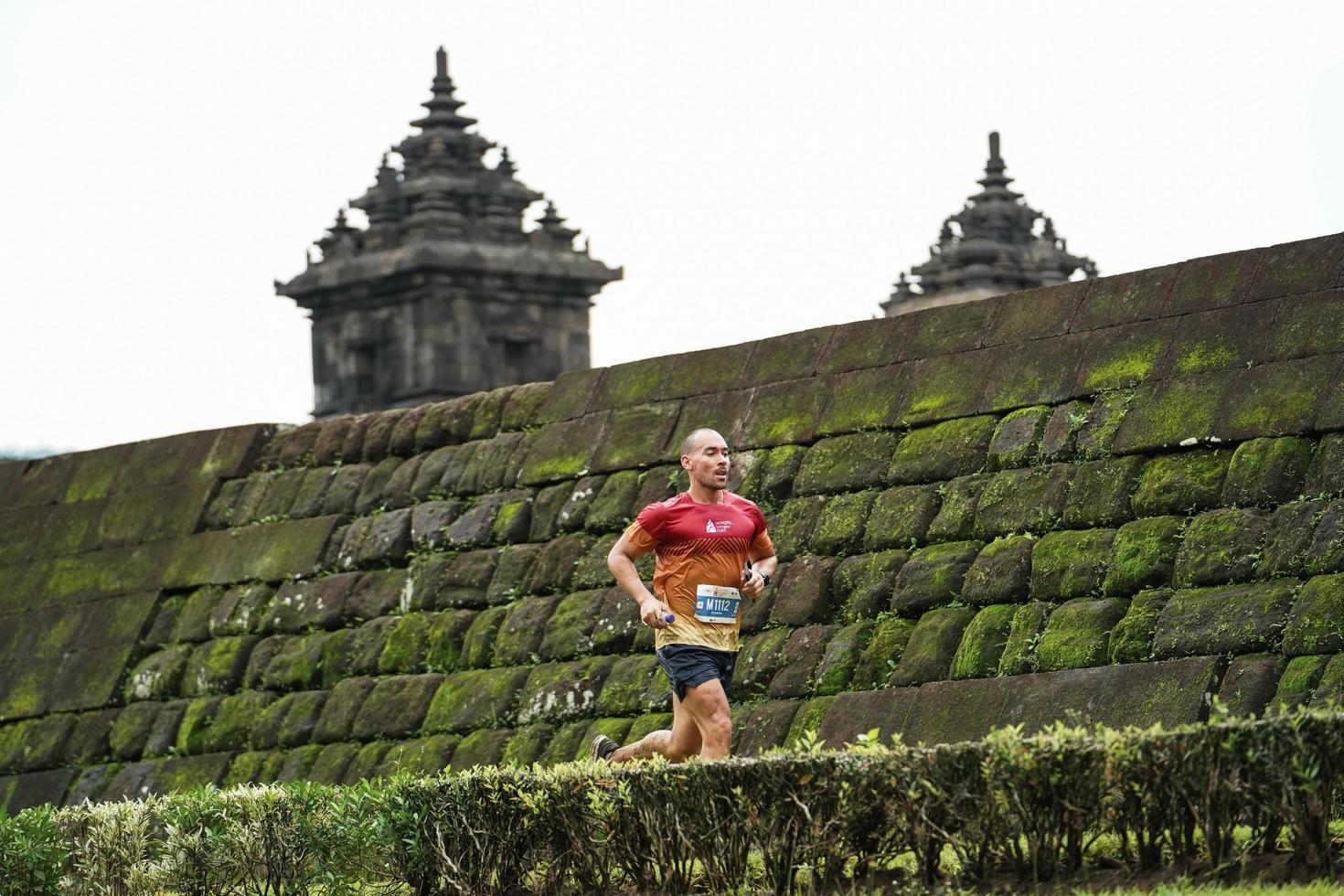 Yogyakarta, Indonesia - November 20, 2022 The Sleman Temple Run contingent passed the scenic route of the Barong temple, they took part in a trail running contest. photo