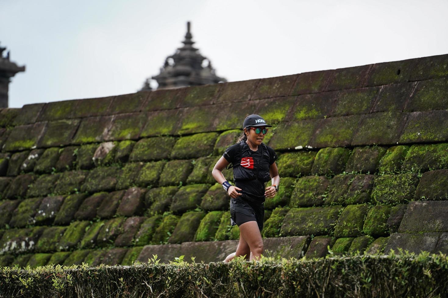 Yogyakarta, Indonesia - November 20, 2022 The Sleman Temple Run contingent passed the scenic route of the Barong temple, they took part in a trail running contest. photo