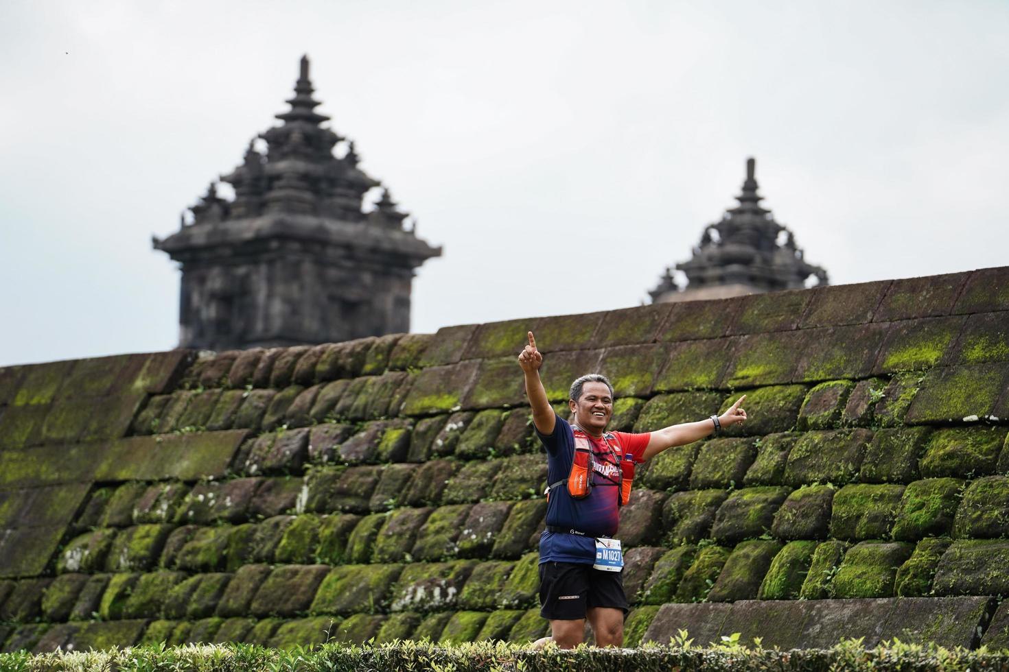 Yogyakarta, Indonesia - November 20, 2022 The Sleman Temple Run contingent passed the scenic route of the Barong temple, they took part in a trail running contest. photo
