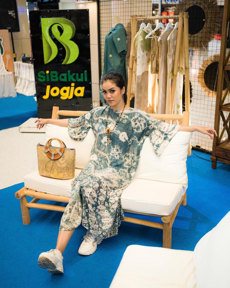 Yogyakarta, Indonesia - December 03, 2022  stylish female models among micro, small and medium enterprises, showing attractive clothes, accessories and properties. photo