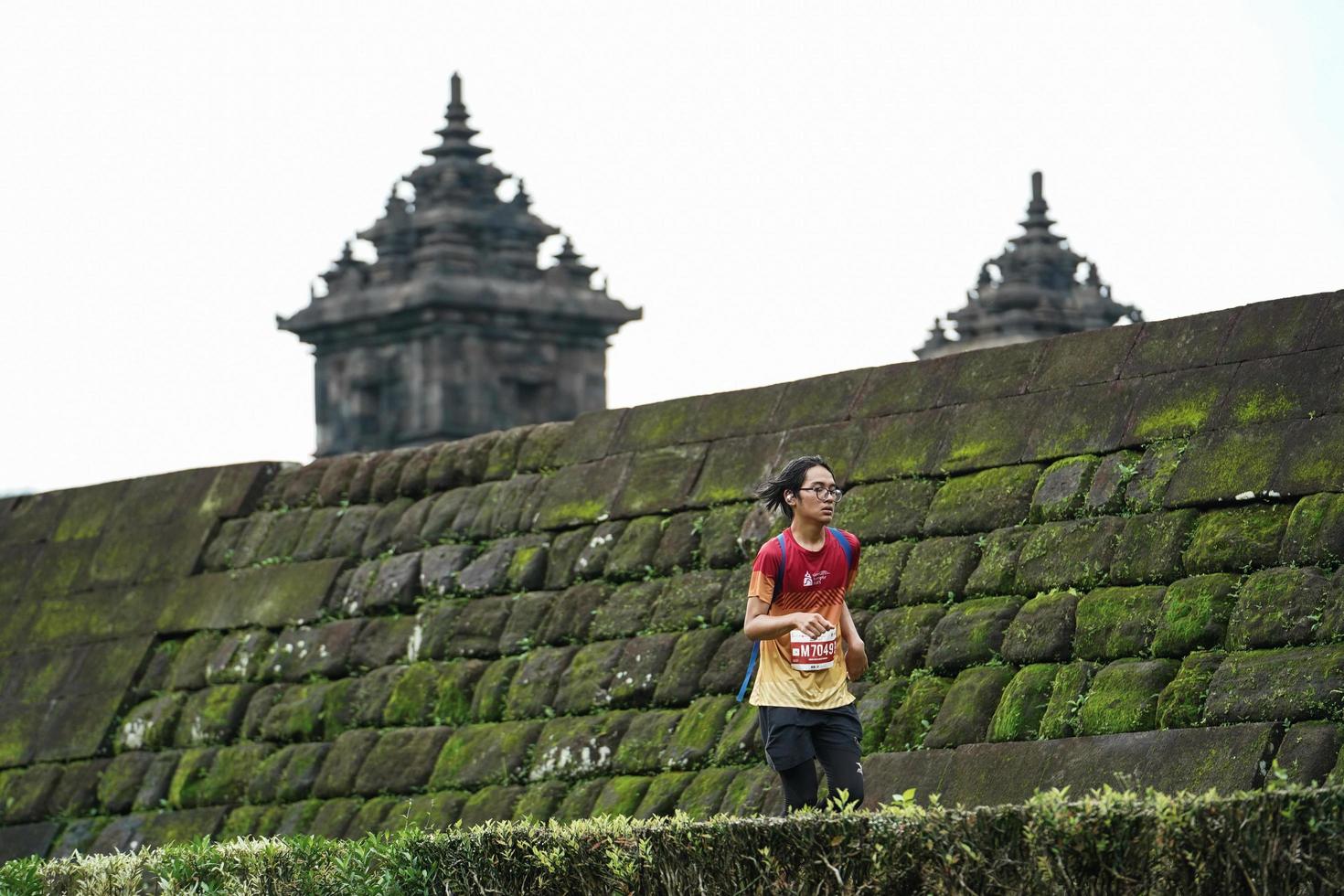 Yogyakarta, Indonesia - November 20, 2022 The Sleman Temple Run contingent passed the scenic route of the Barong temple, they took part in a trail running contest. photo