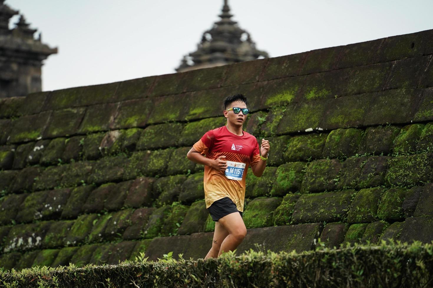 Yogyakarta, Indonesia - November 20, 2022 The Sleman Temple Run contingent passed the scenic route of the Barong temple, they took part in a trail running contest. photo