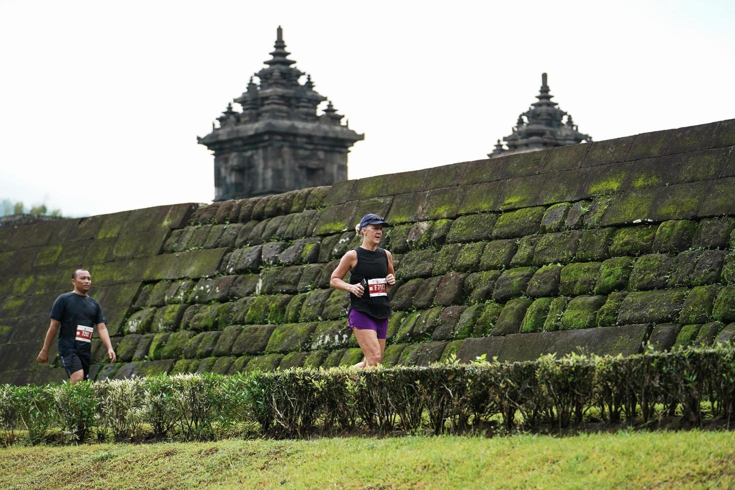 Yogyakarta, Indonesia - November 20, 2022 The Sleman Temple Run contingent passed the scenic route of the Barong temple, they took part in a trail running contest. photo