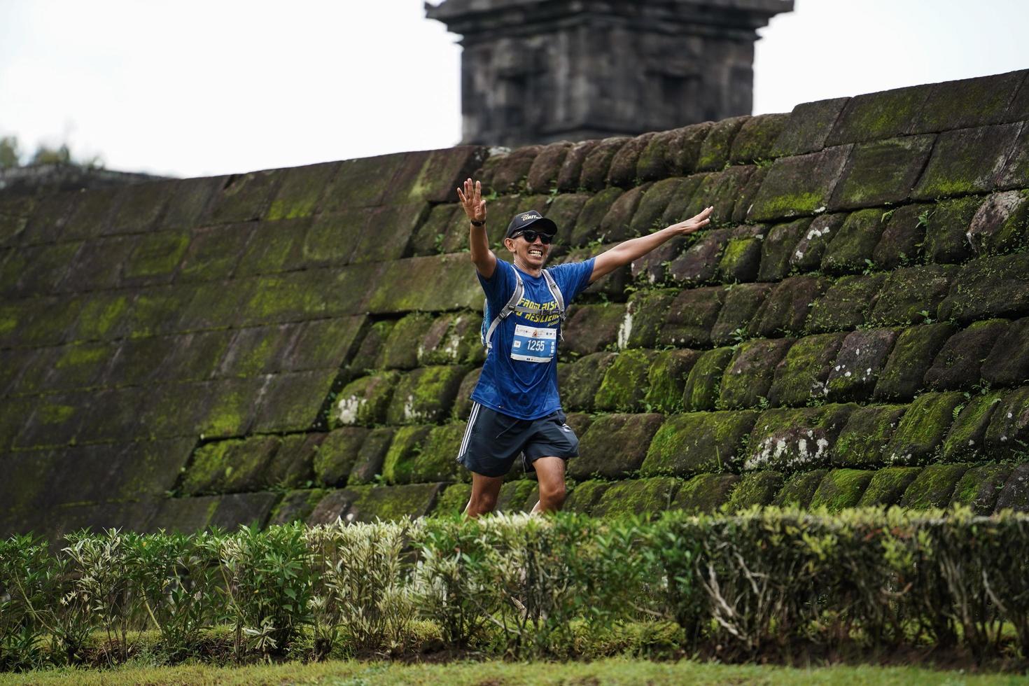 Yogyakarta, Indonesia - November 20, 2022 The Sleman Temple Run contingent passed the scenic route of the Barong temple, they took part in a trail running contest. photo