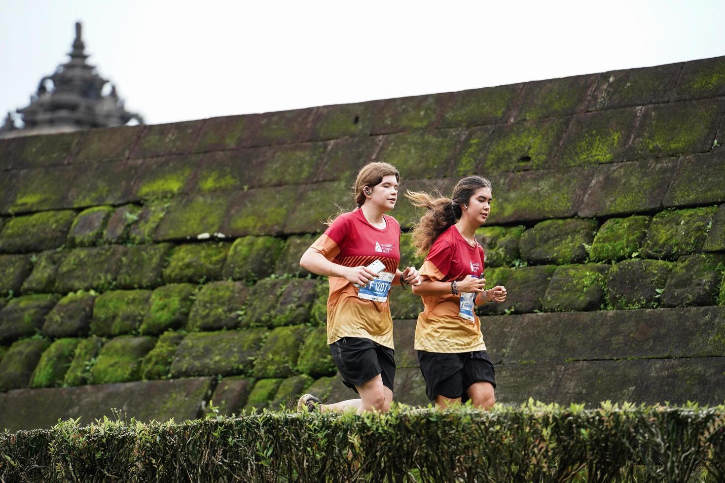 Yogyakarta, Indonesia - November 20, 2022 The Sleman Temple Run contingent passed the scenic route of the Barong temple, they took part in a trail running contest. photo