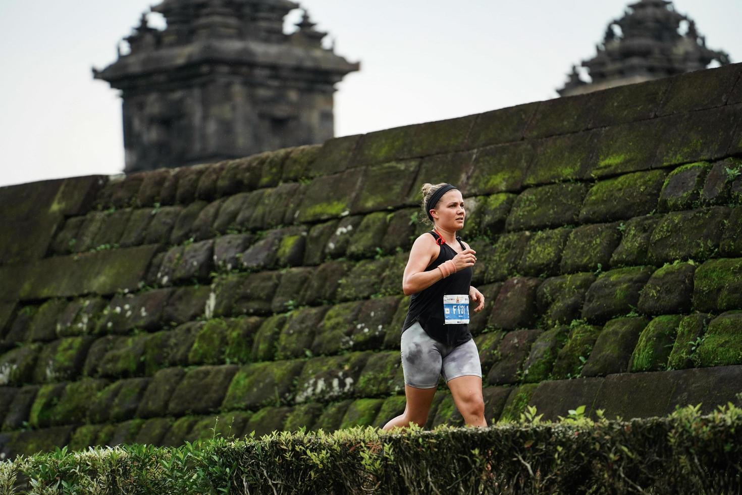 Yogyakarta, Indonesia - November 20, 2022 The Sleman Temple Run contingent passed the scenic route of the Barong temple, they took part in a trail running contest. photo