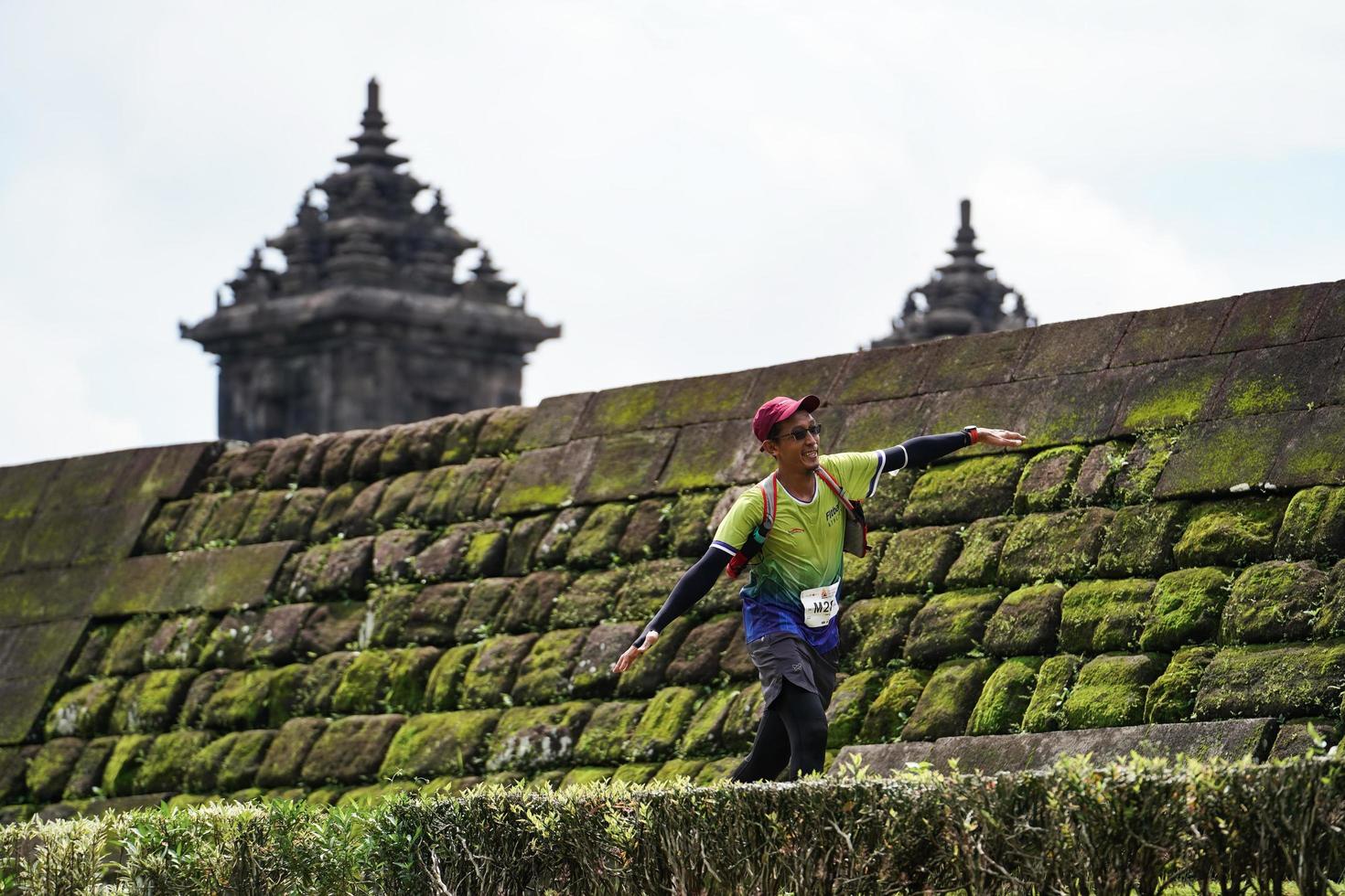 Yogyakarta, Indonesia - November 20, 2022 The Sleman Temple Run contingent passed the scenic route of the Barong temple, they took part in a trail running contest. photo