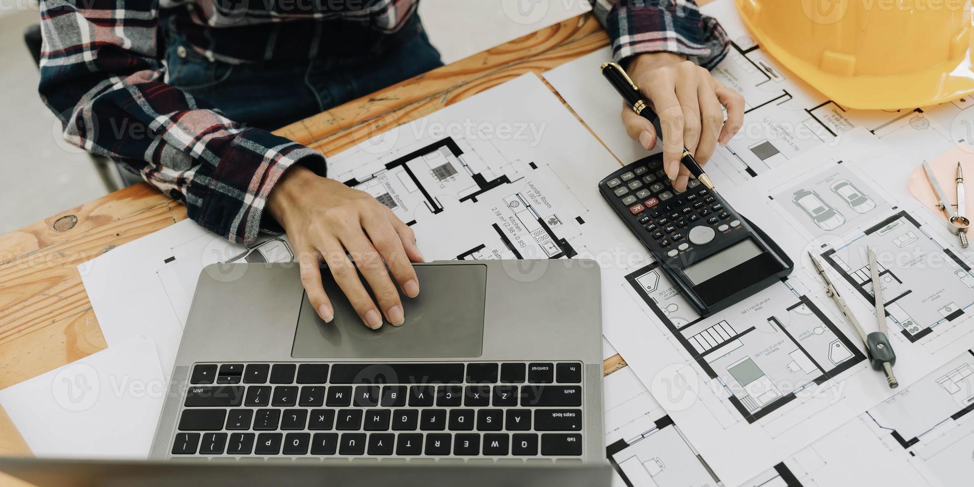 Concept architects, engineer holding pen pointing equipment architects On the desk photo
