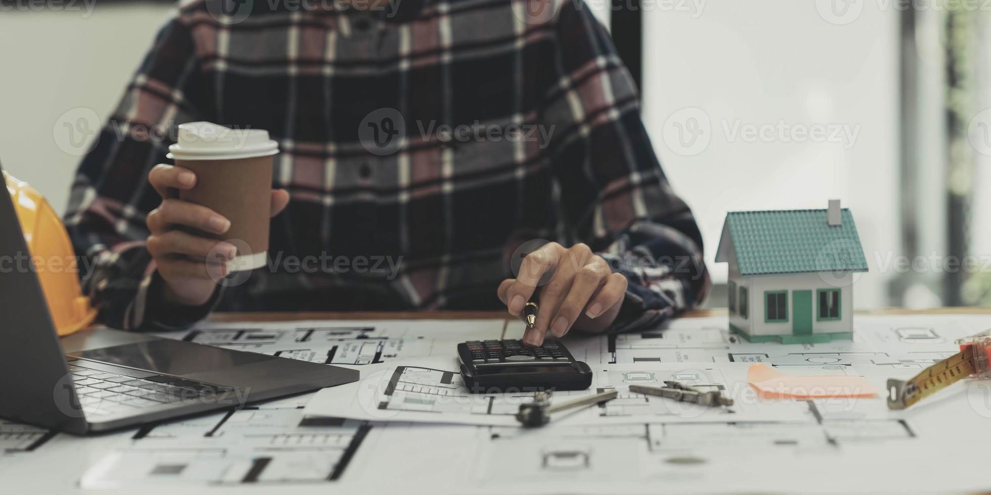 Concept architects, engineer holding pen pointing equipment architects On the desk photo