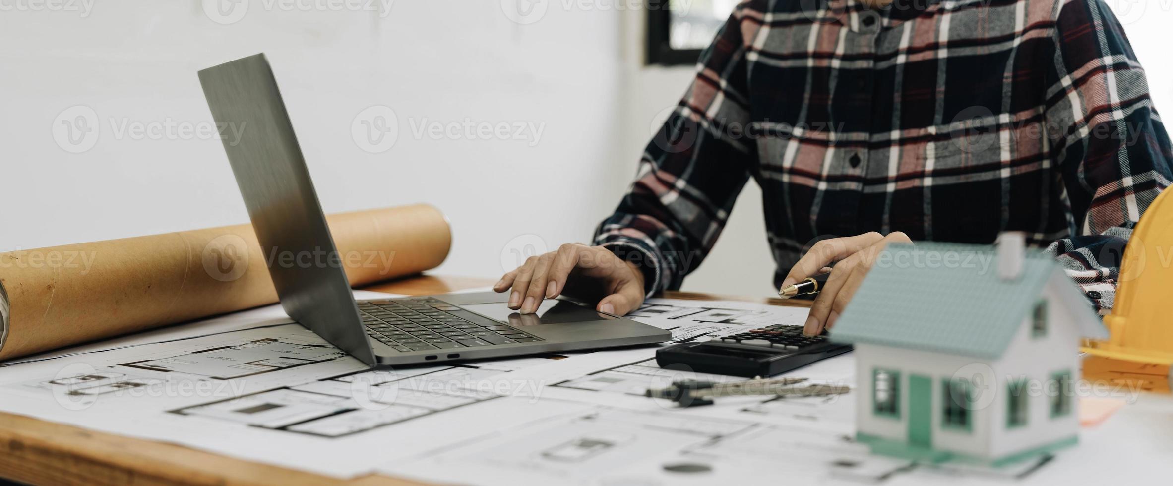 Concept architects, engineer holding pen pointing equipment architects On the desk photo