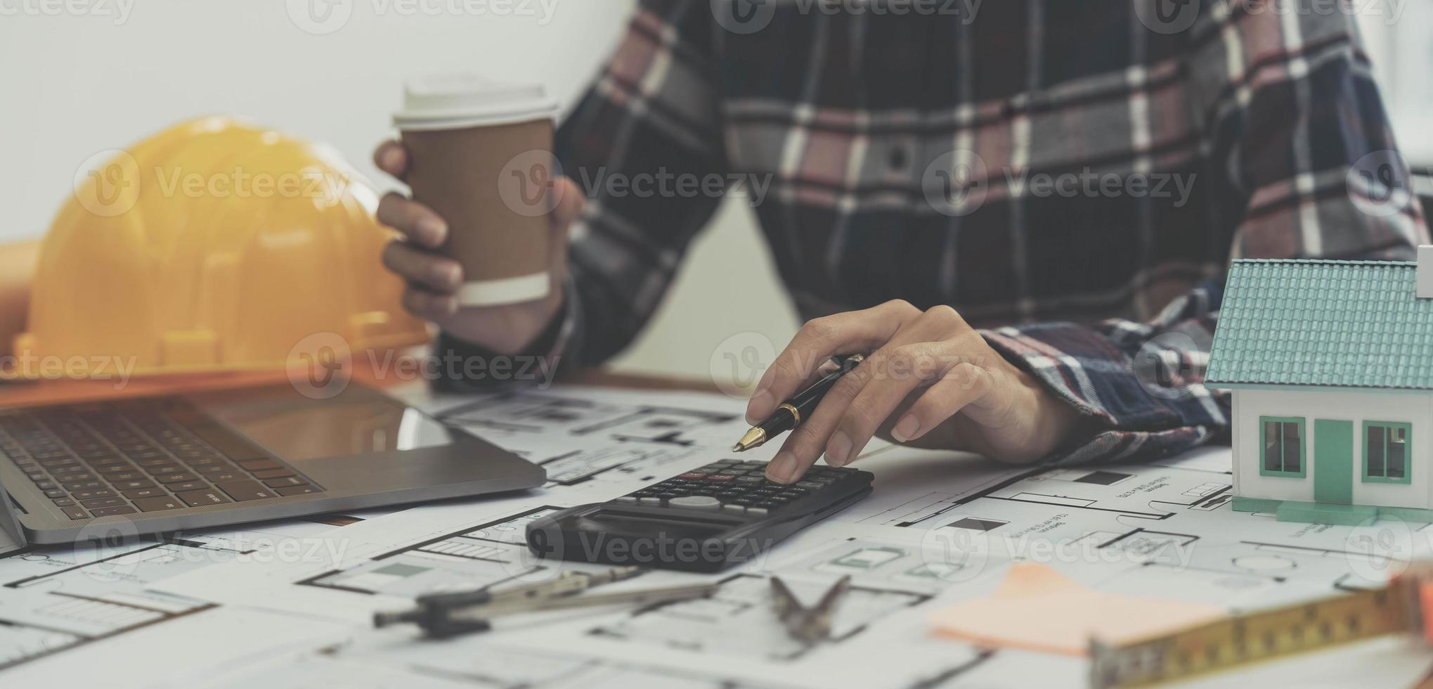 Concept architects, engineer holding pen pointing equipment architects On the desk photo