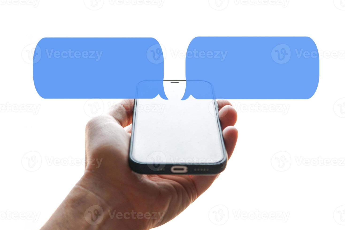 hand holding a smartphone with chat symbol, texting on the phone, phone addiction photo