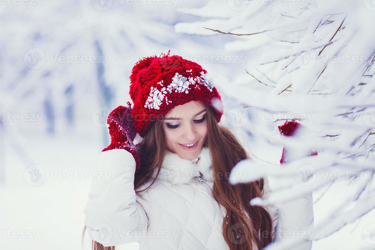 Winter portrait of young beautiful brunette woman photo