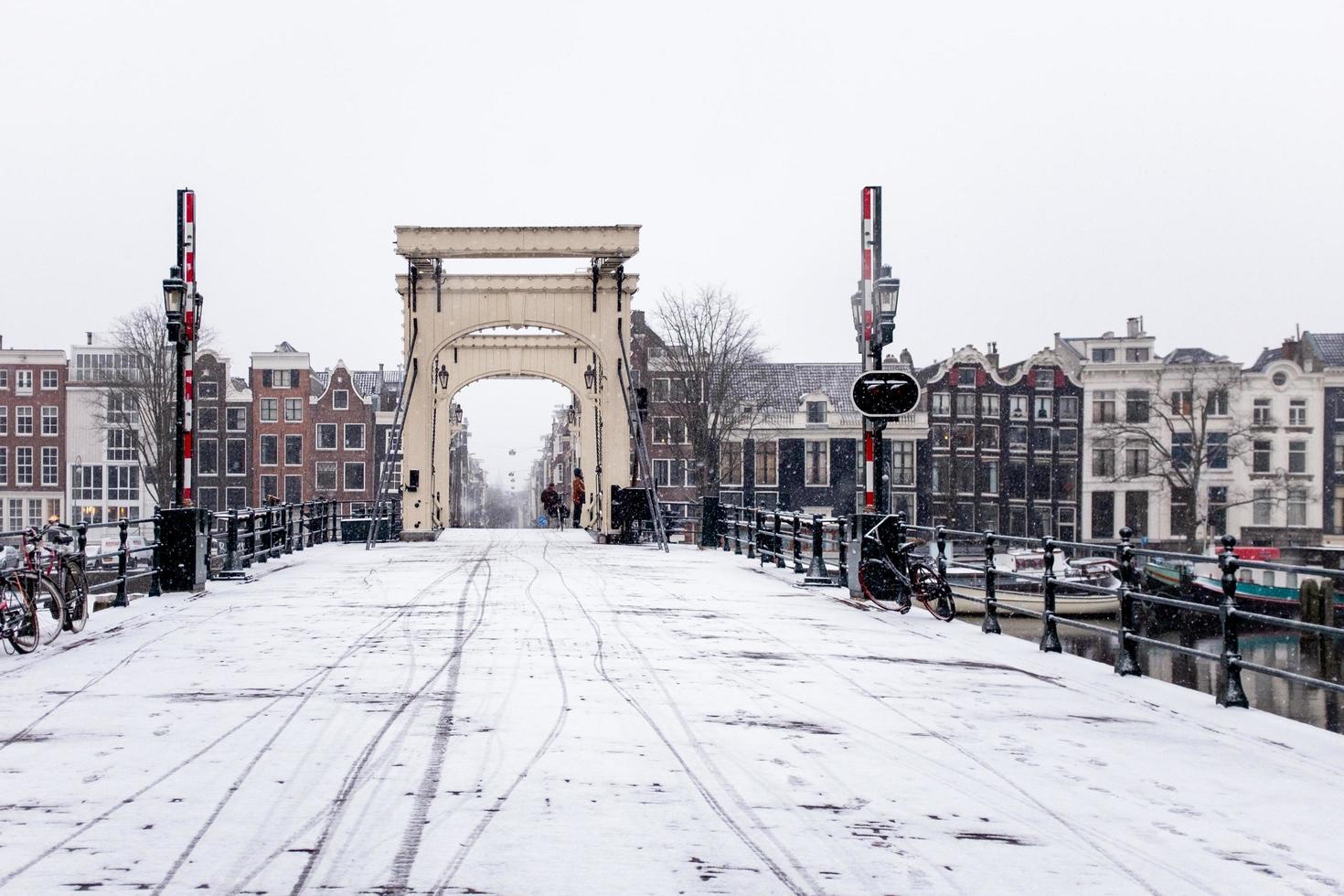 Snow on bridge in Amsterdam photo