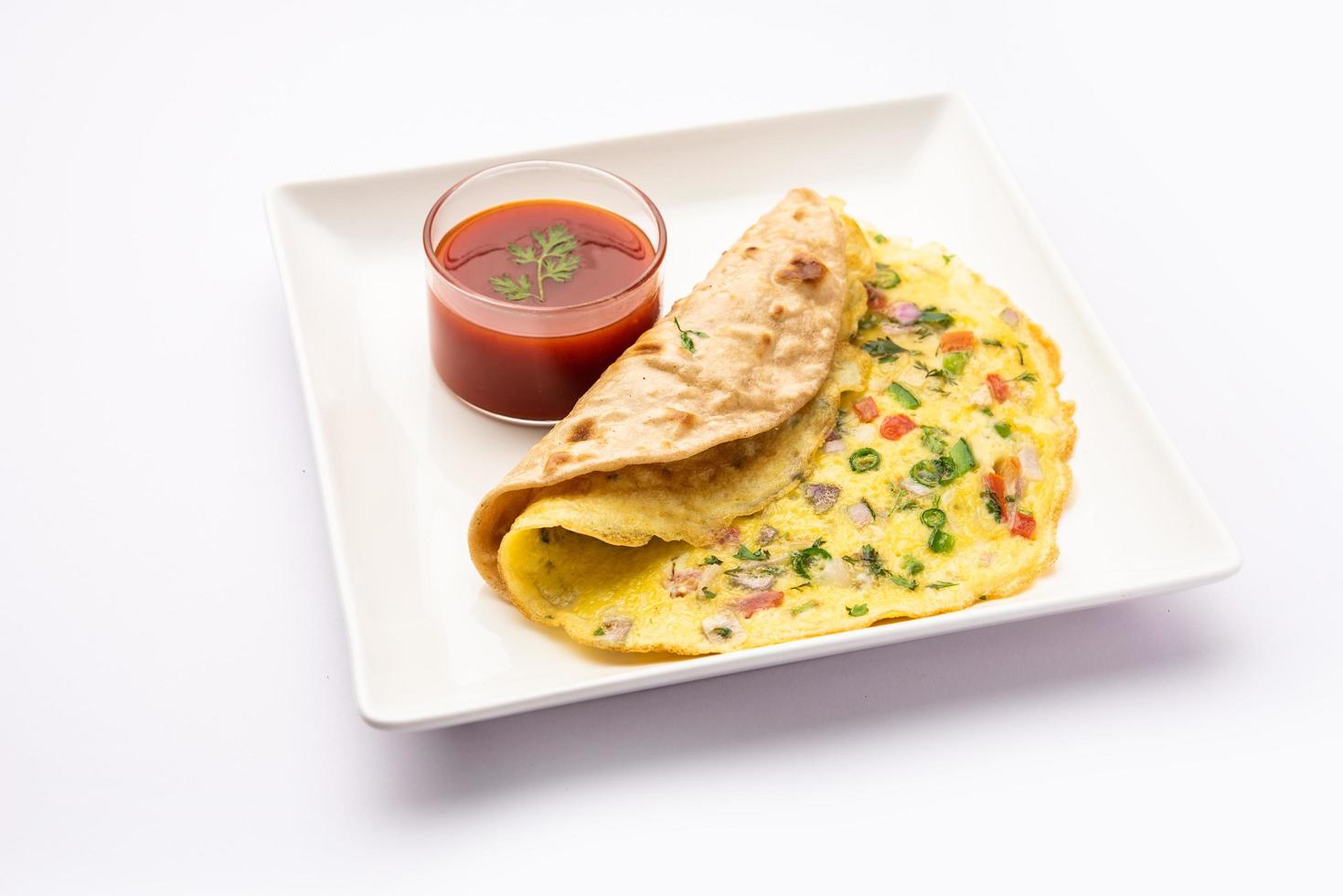 Omelette chapati roll or Franky. Indian Popular, quick healthy recipe for kid's tiffin or lunch box photo