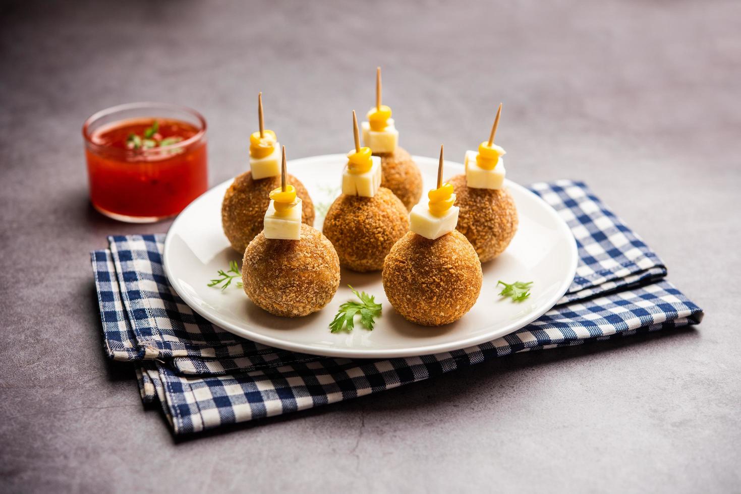 Corn Cheese balls with dip - popular party snack from India photo