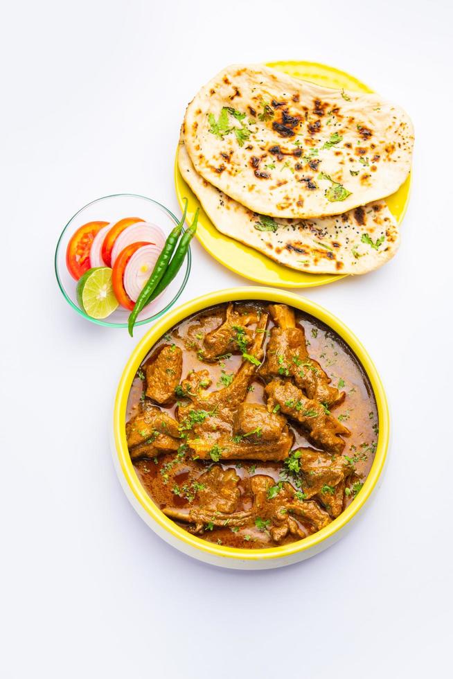 Indian style Mutton OR Gosht Masala OR indian lamb meat rogan josh served with Naan photo