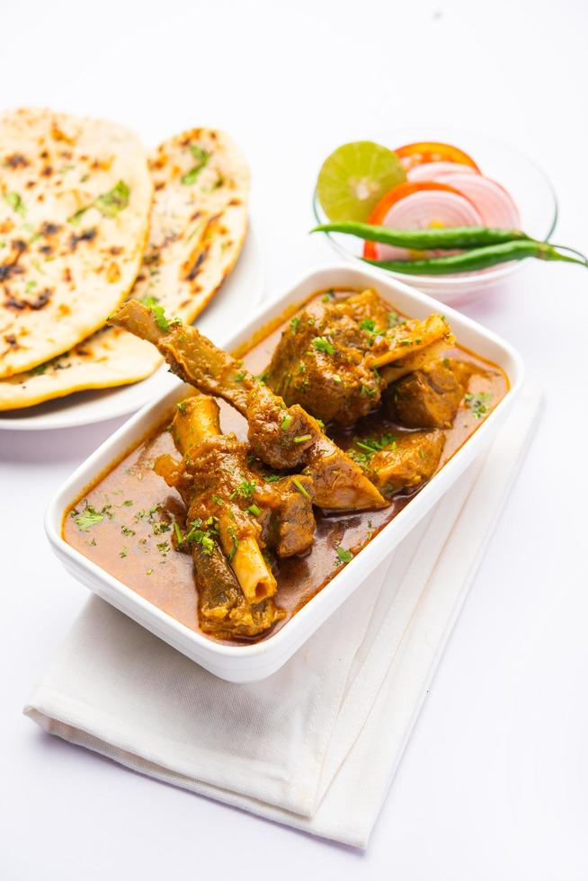 Indian style Mutton OR Gosht Masala OR indian lamb meat rogan josh served with Naan photo
