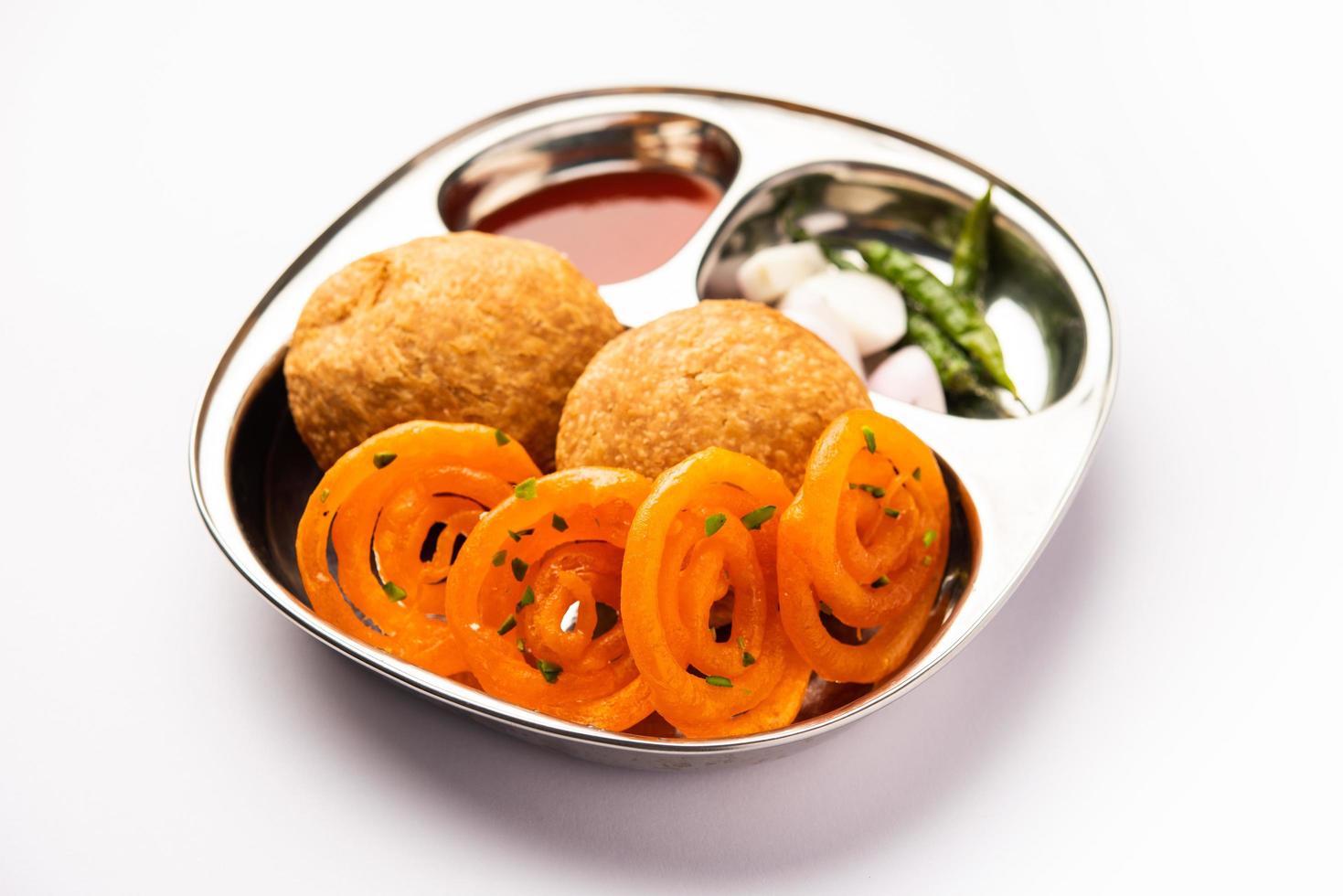Kachori with Jalebi, snack combination from India also called kachauri