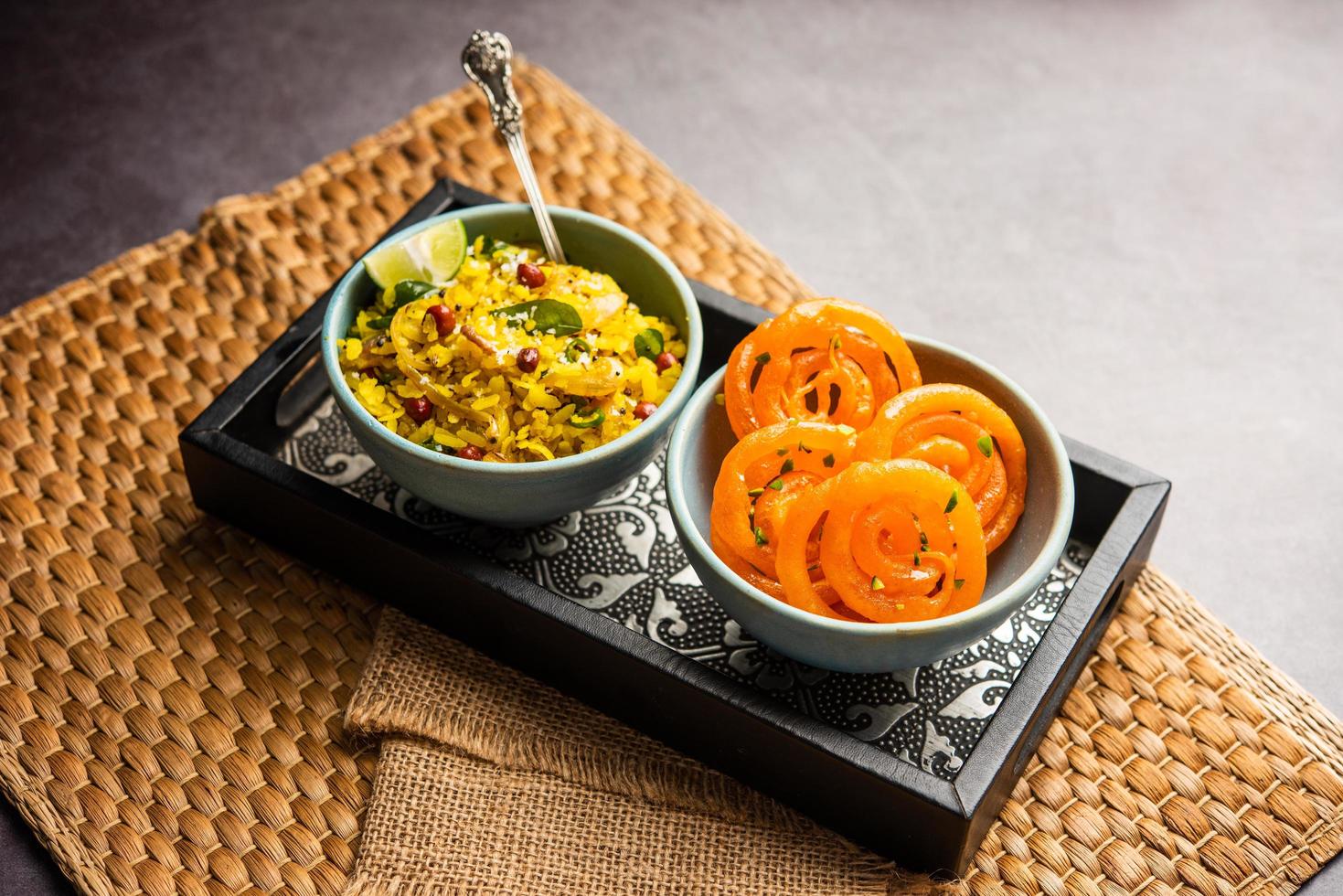 Aloo Poha with Jalebi, snack combination also called imarti and kande pohe photo