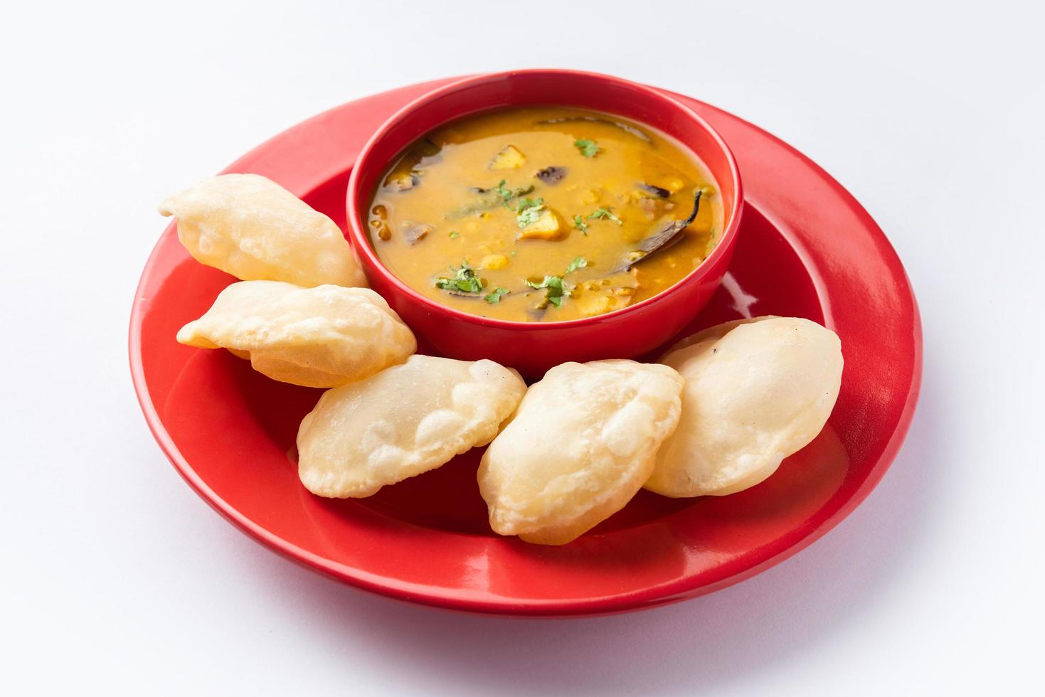 Luchi Cholar Dal or Fried bread made of flour served along with curried Chana or Bengal gram photo