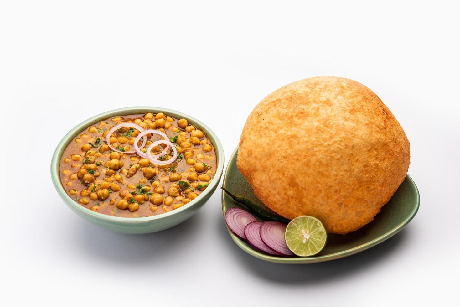 Chole bhature is a North Indian food dish. A combination of chana masala and bhatura or puri photo