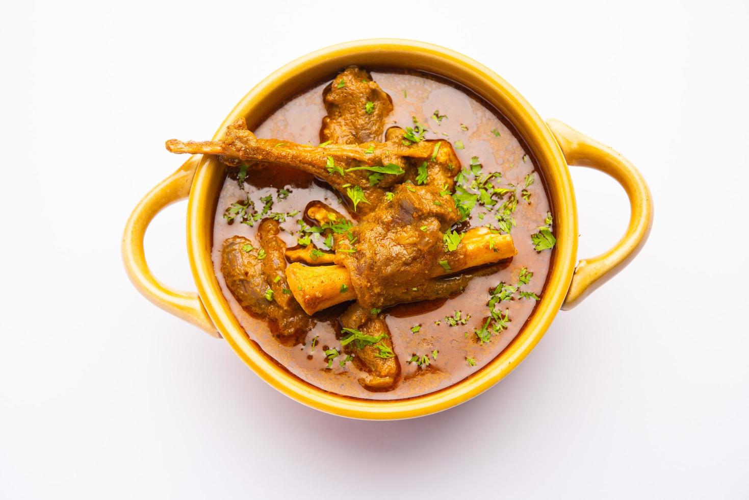 Indian style Mutton OR Gosht Masala OR indian lamb meat rogan josh served with Naan photo