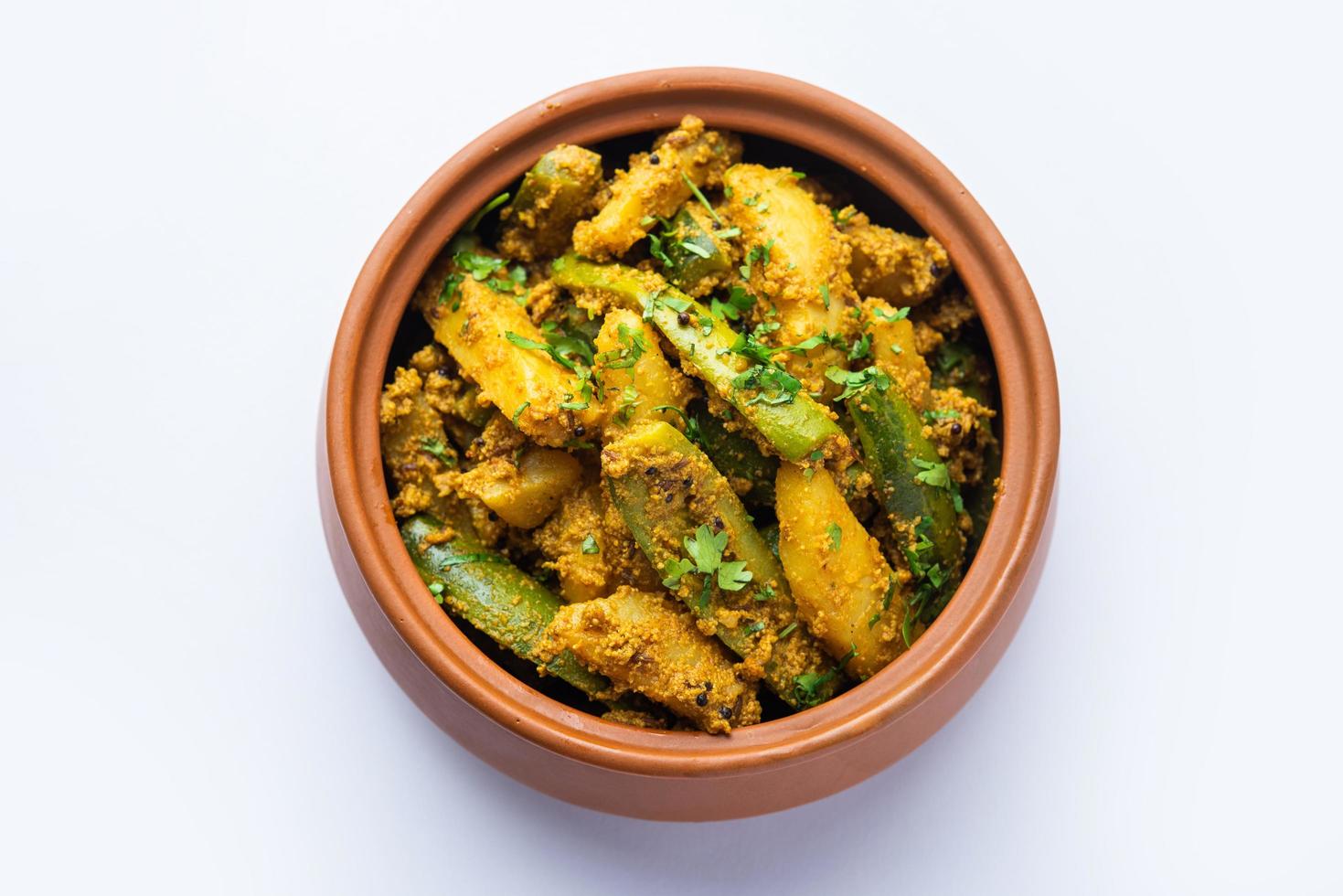 Aloo Potol or Dalna Recipe is a traditional sabzi from bengal made with potato and pointed gourd photo