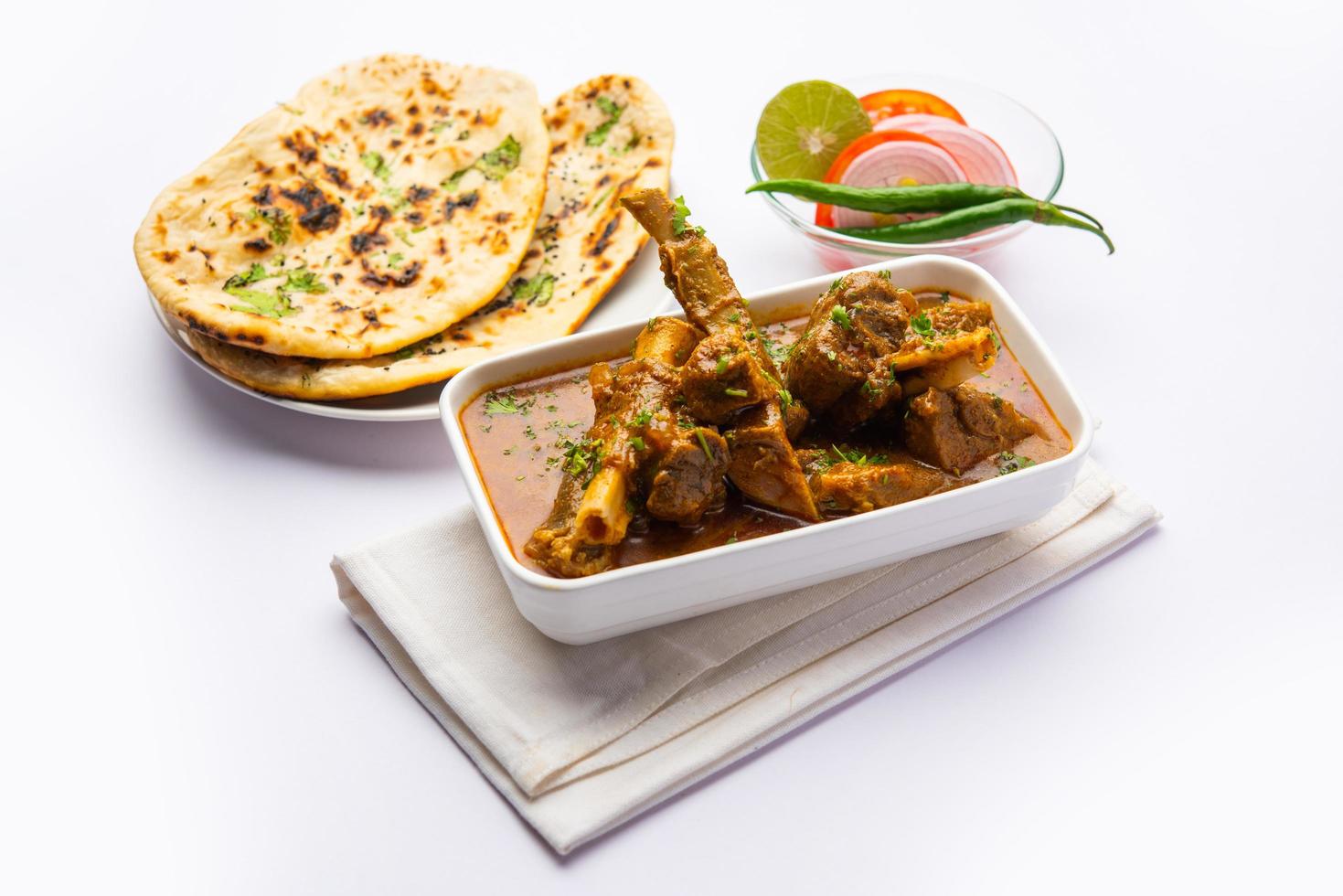 Indian style Mutton OR Gosht Masala OR indian lamb meat rogan josh served with Naan photo