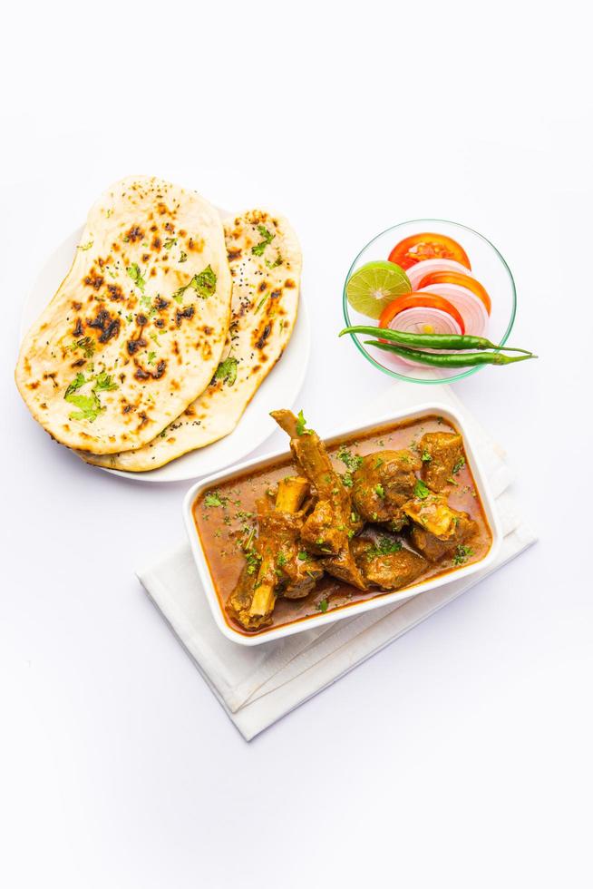 Indian style Mutton OR Gosht Masala OR indian lamb meat rogan josh served with Naan photo