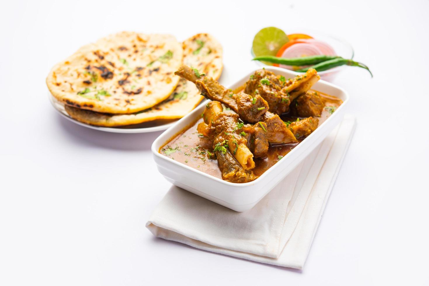 Indian style Mutton OR Gosht Masala OR indian lamb meat rogan josh served with Naan photo