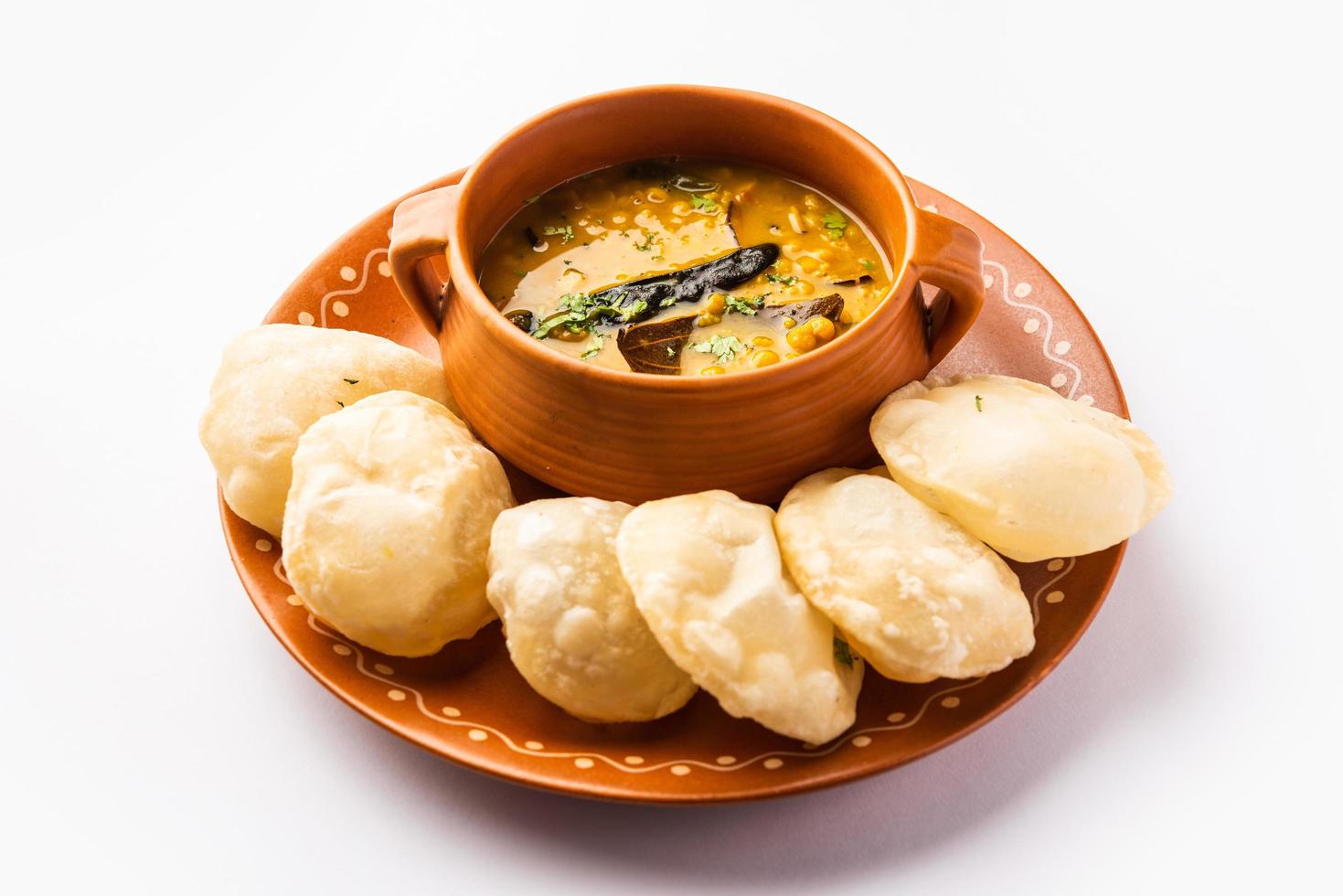 Luchi Cholar Dal or Fried bread made of flour served along with curried Chana or Bengal gram photo