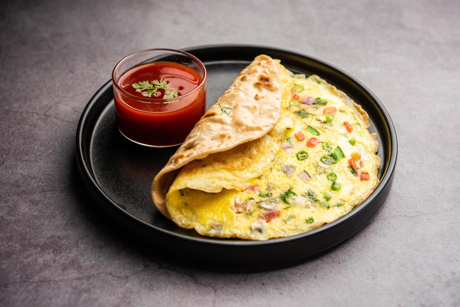 Omelette chapati roll or Franky. Indian Popular, quick healthy recipe for kid's tiffin or lunch box photo