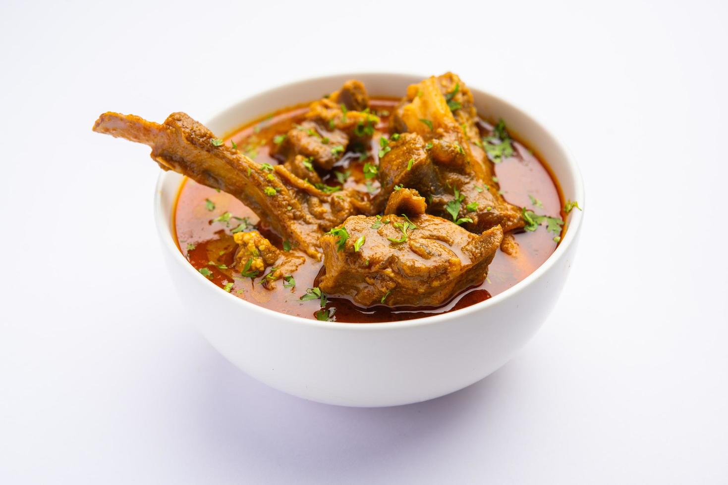 Indian style Mutton OR Gosht Masala OR indian lamb meat rogan josh served with Naan photo