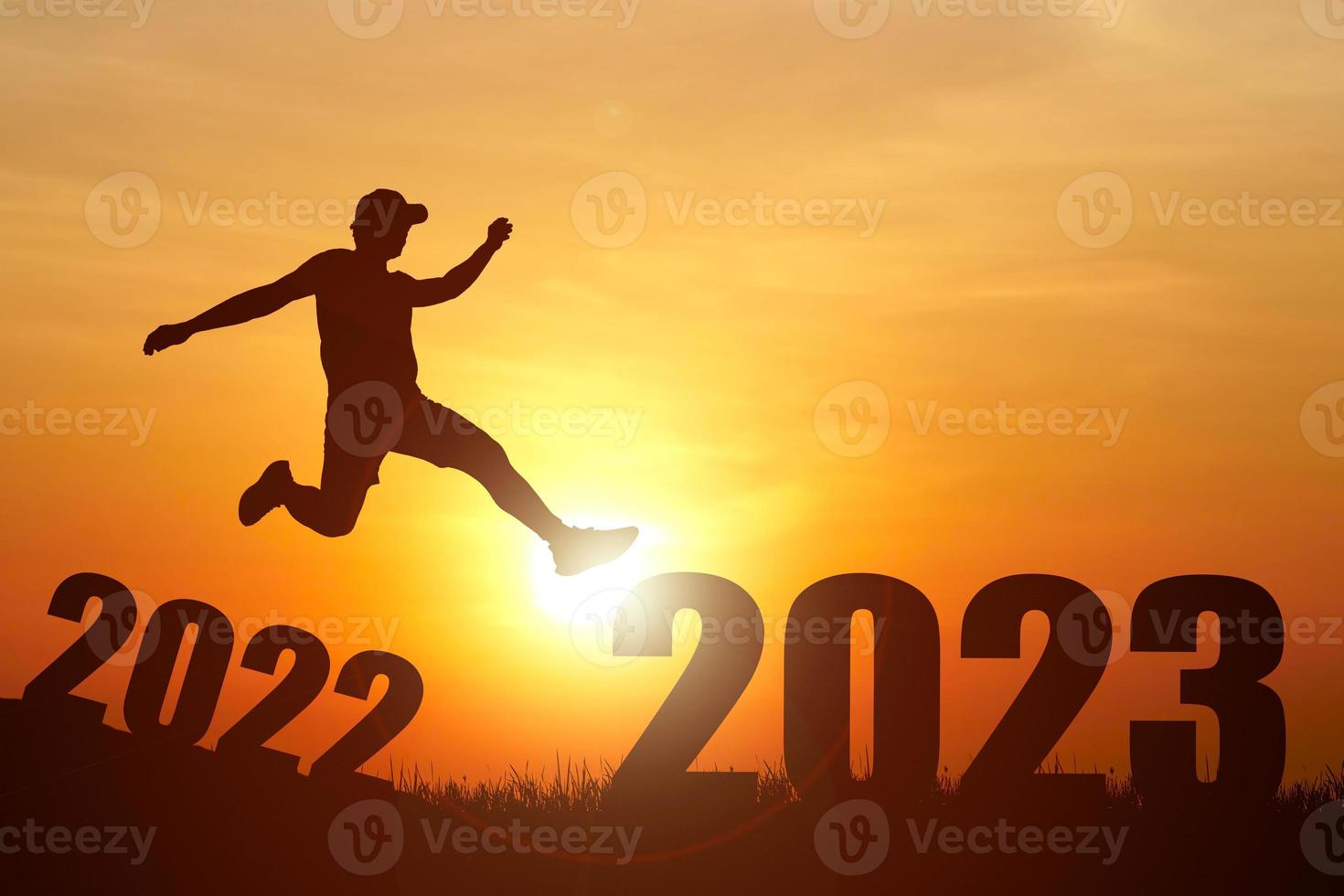 The concept of moving through 2022 to 2023. Happy New Year 2023. photo