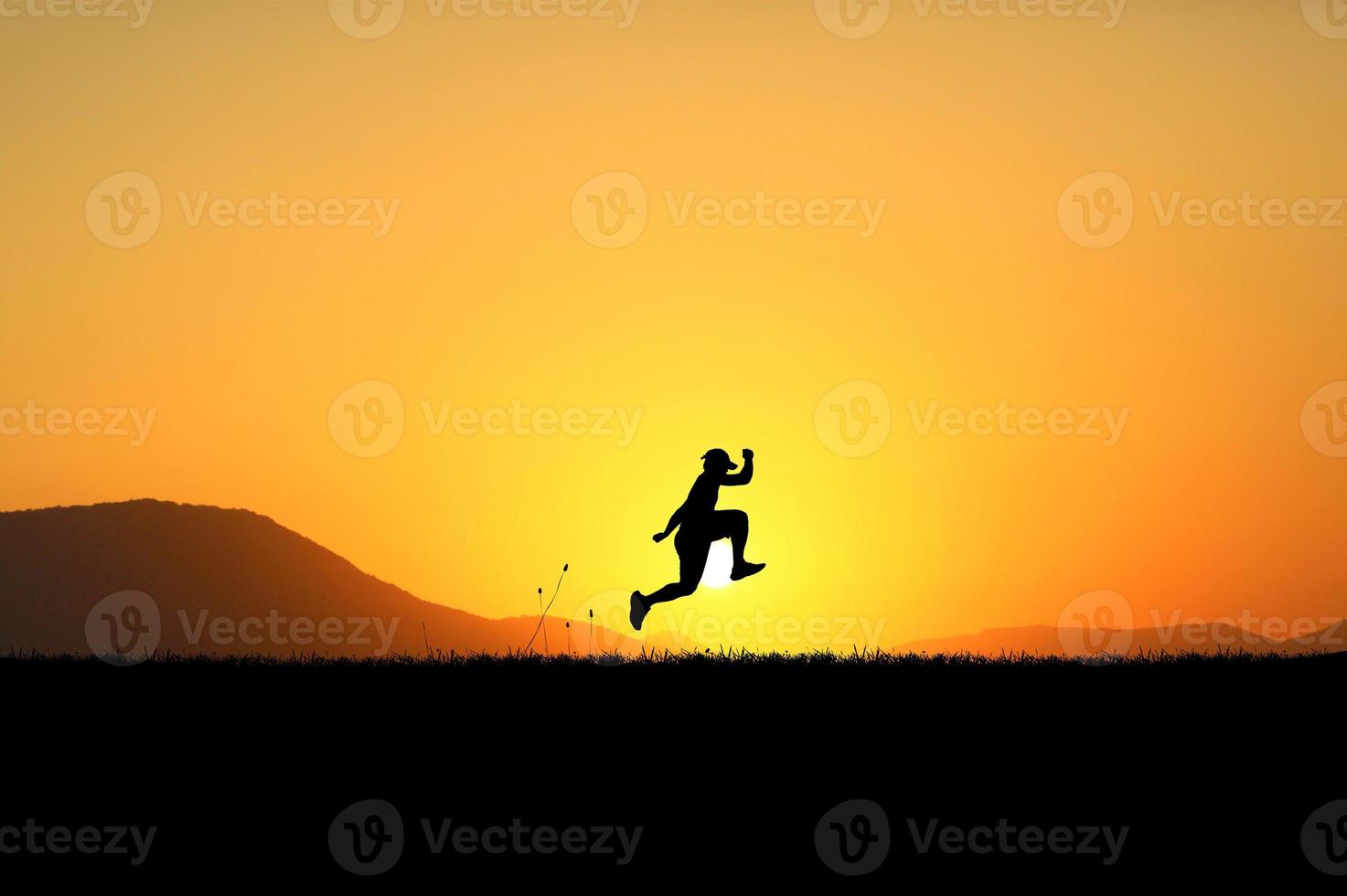 happy man running jumping in the meadow photo