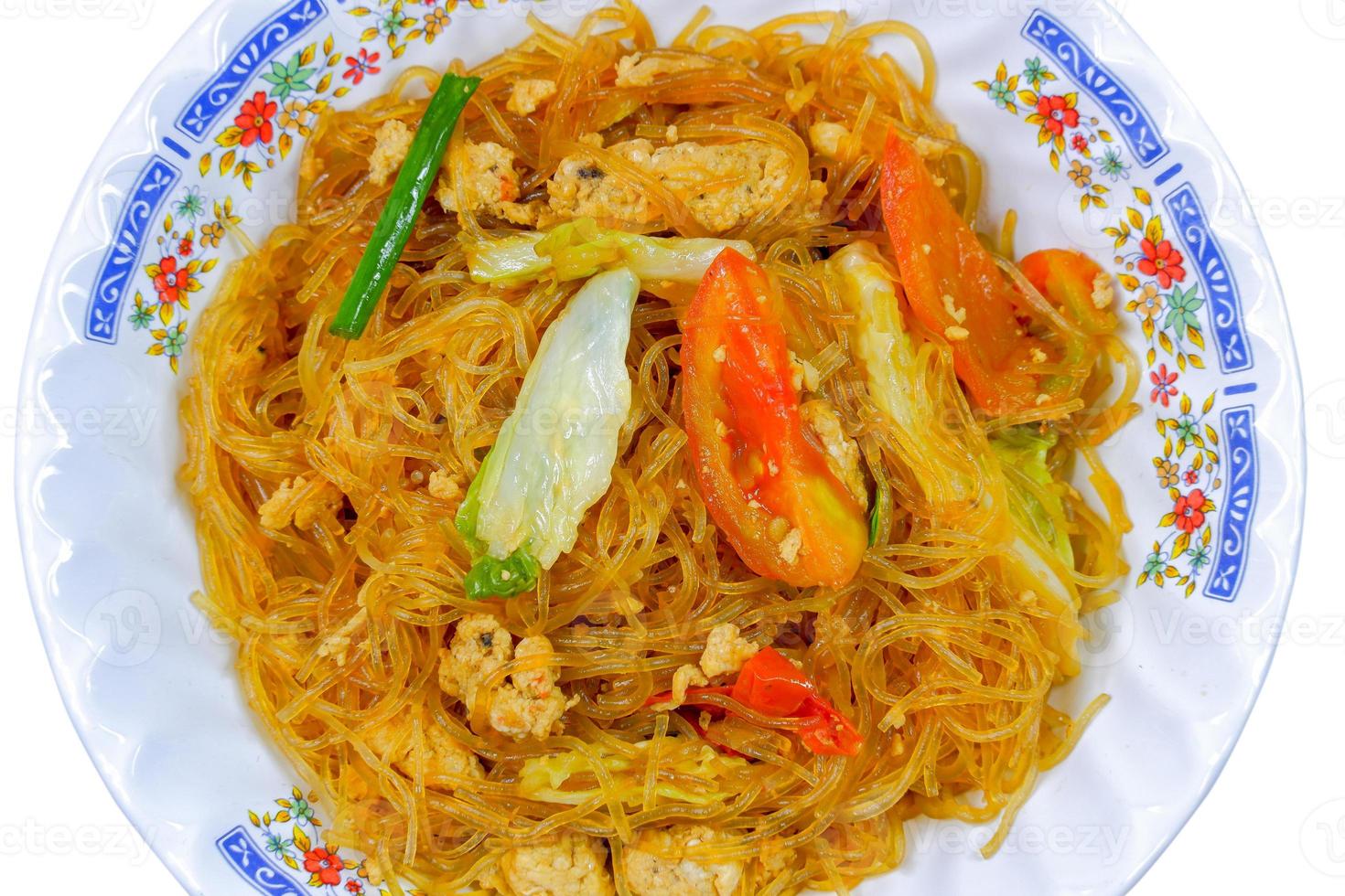 Thai food ,Stir-fried vermicelli with egg, tomatoes and vegetables on a white background photo