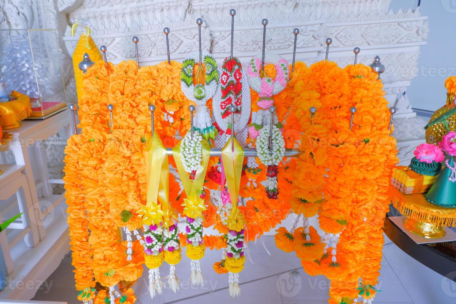 equipment for worship There is a garland made of realistic flowers. photo