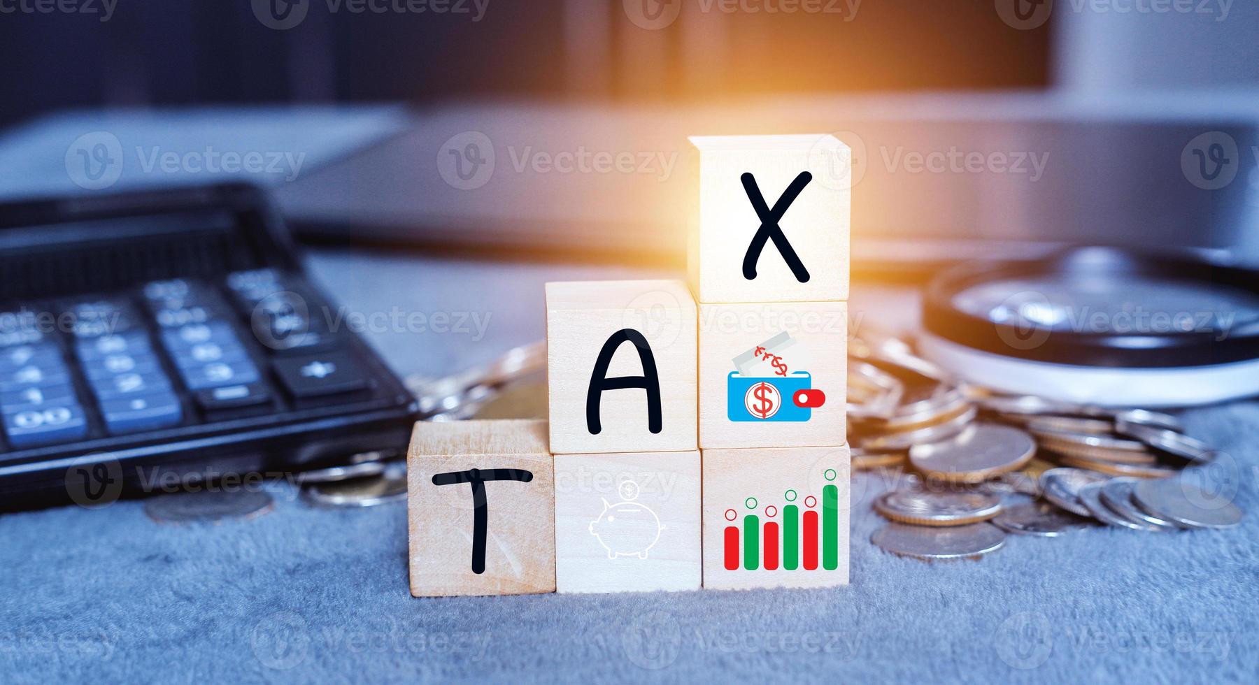 Concept of taxes for car on block cubes paid by individuals and corporations such as VAT, income tax and property tax Data analysis, paperwork,Financial research. photo