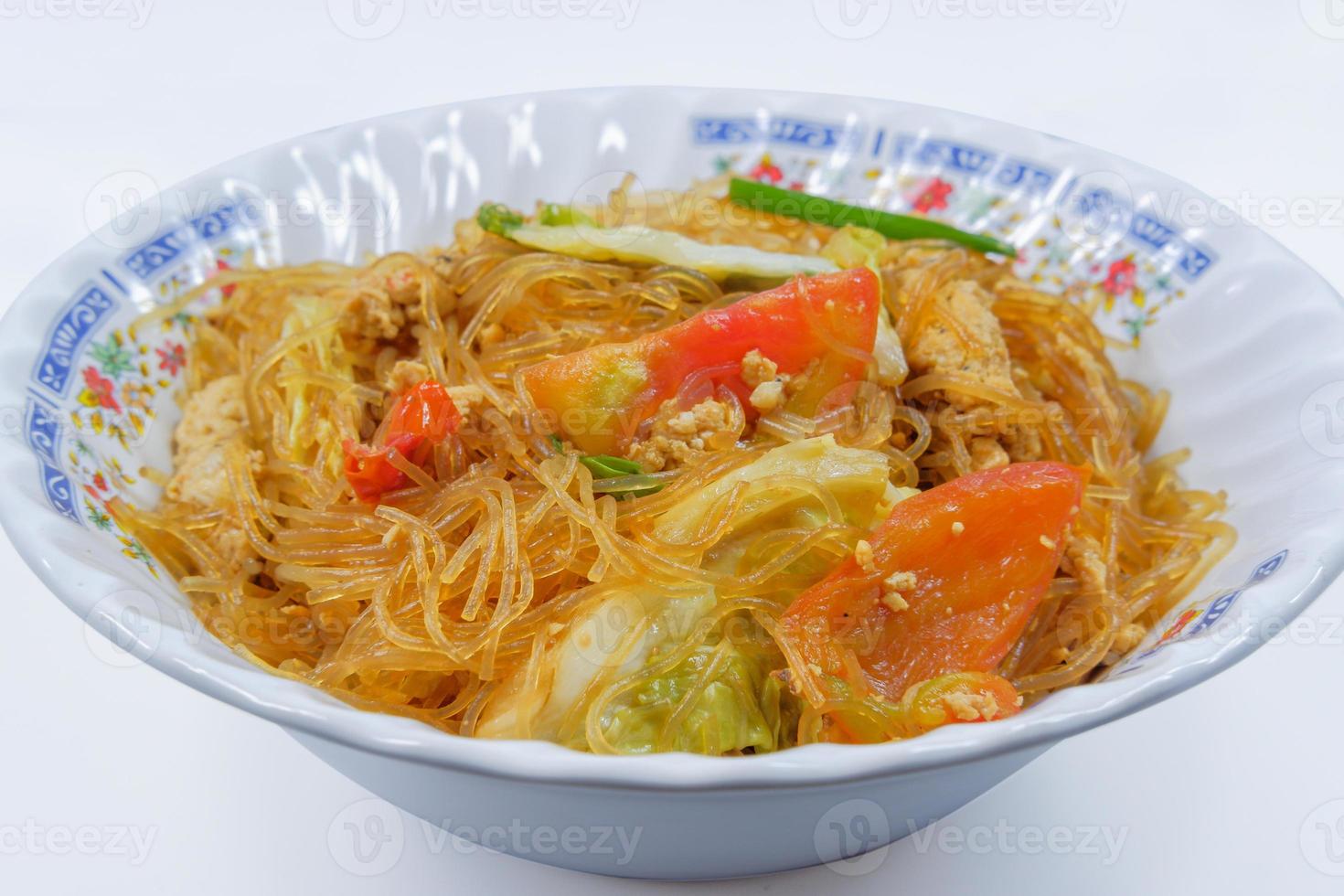 Thai food ,Stir-fried vermicelli with egg, tomatoes and vegetables on a white background photo