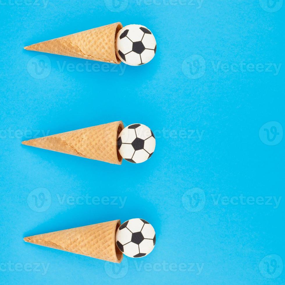 Football macaroons in waffle cones photo