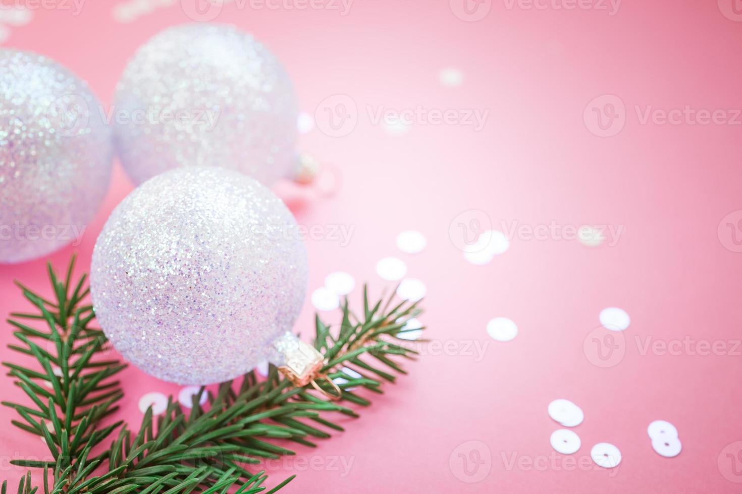 Christmas pearl decoration balls pink background photo