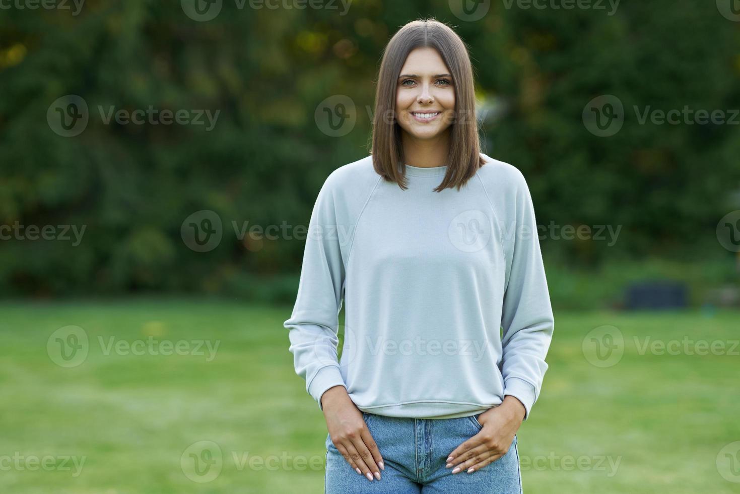 Young woman in gray blouse photo
