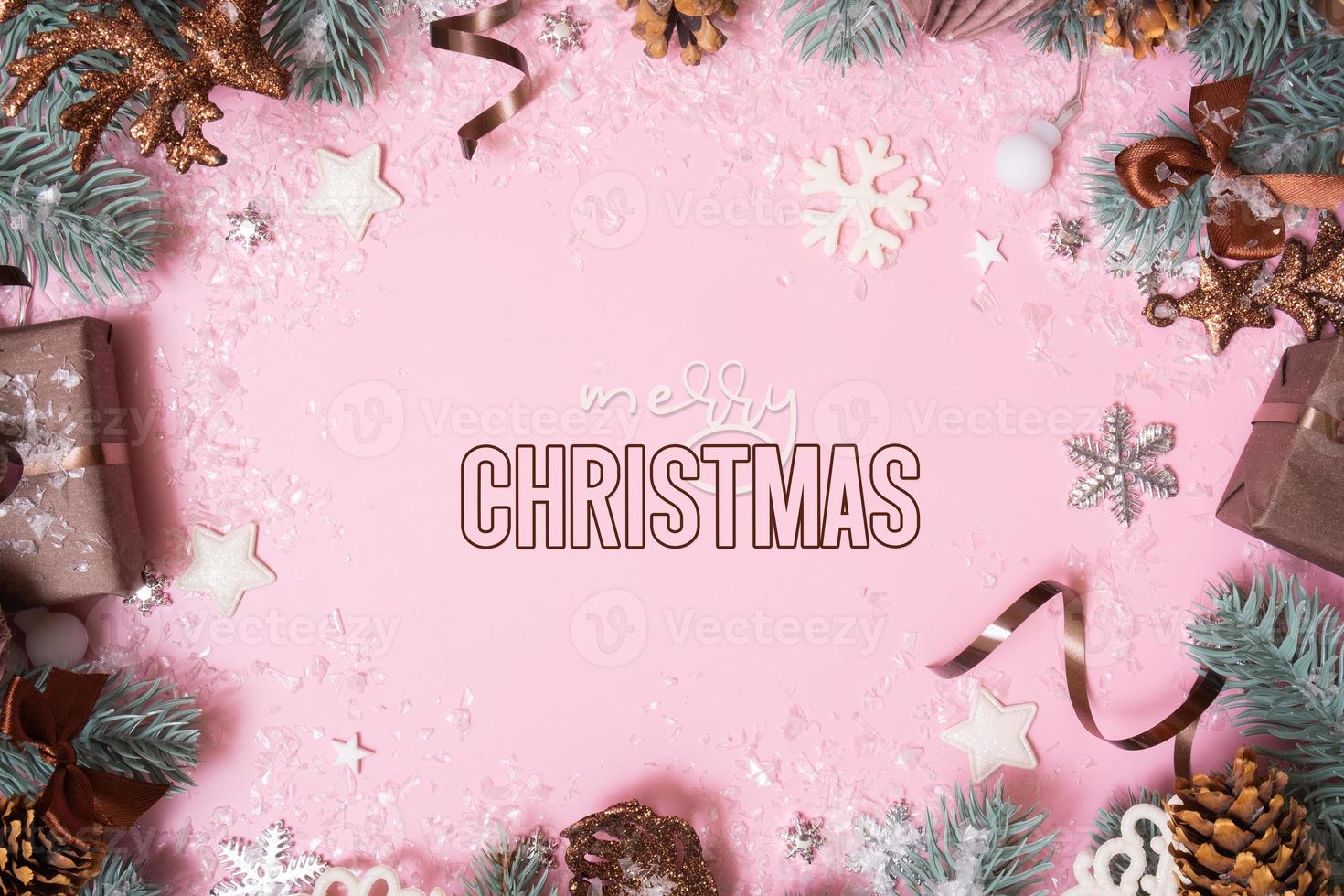 Merry Christmas text and winter decoration on colored background. Xmas greeting card photo