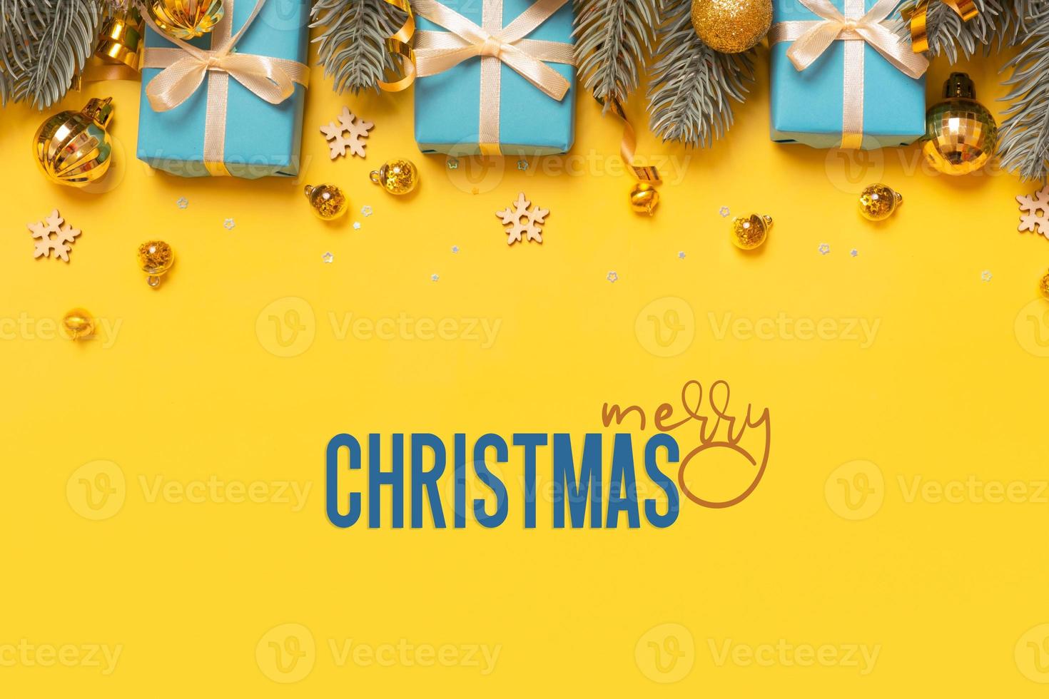 Christmas background with pine tree, gifts and festive decorations top view. Christmas flat lay. Copy space photo