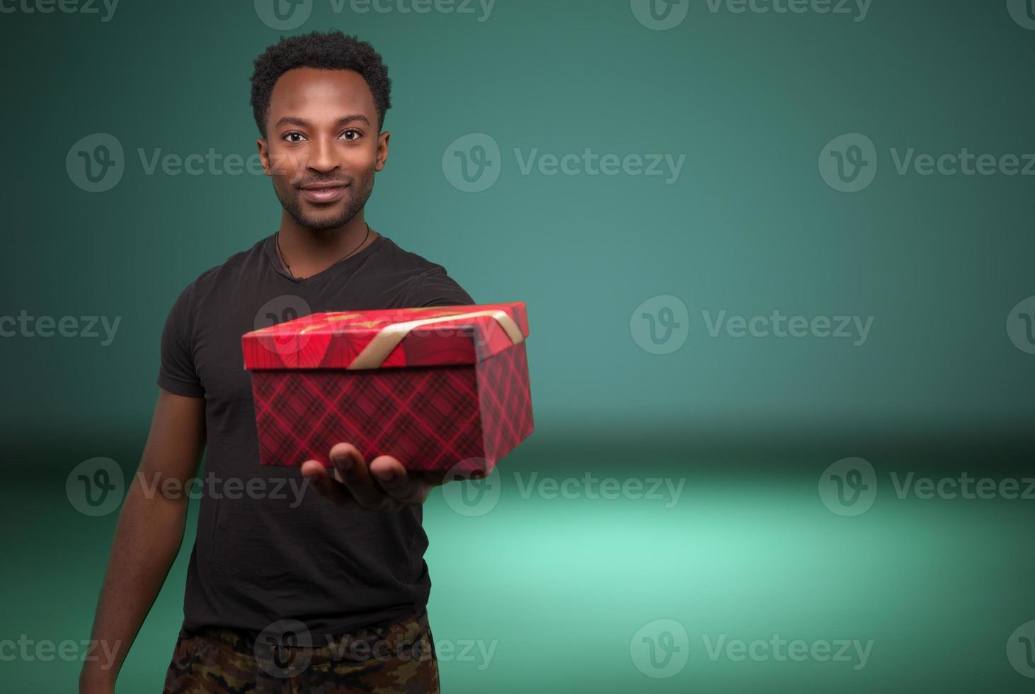 christmas present man showing surprise giving gift box holiday celebration copy space background photo