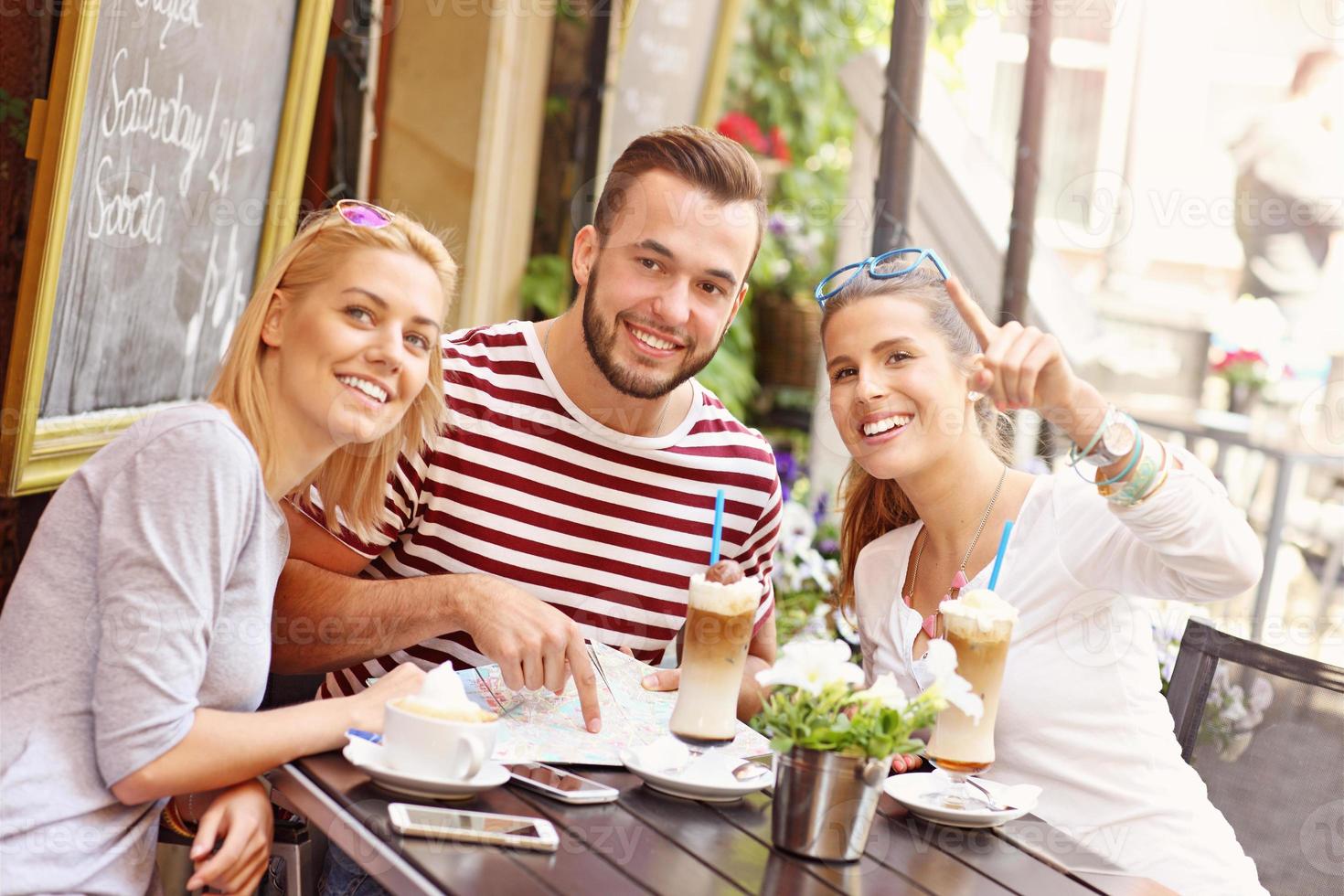 Group of tourists in the cafe photo
