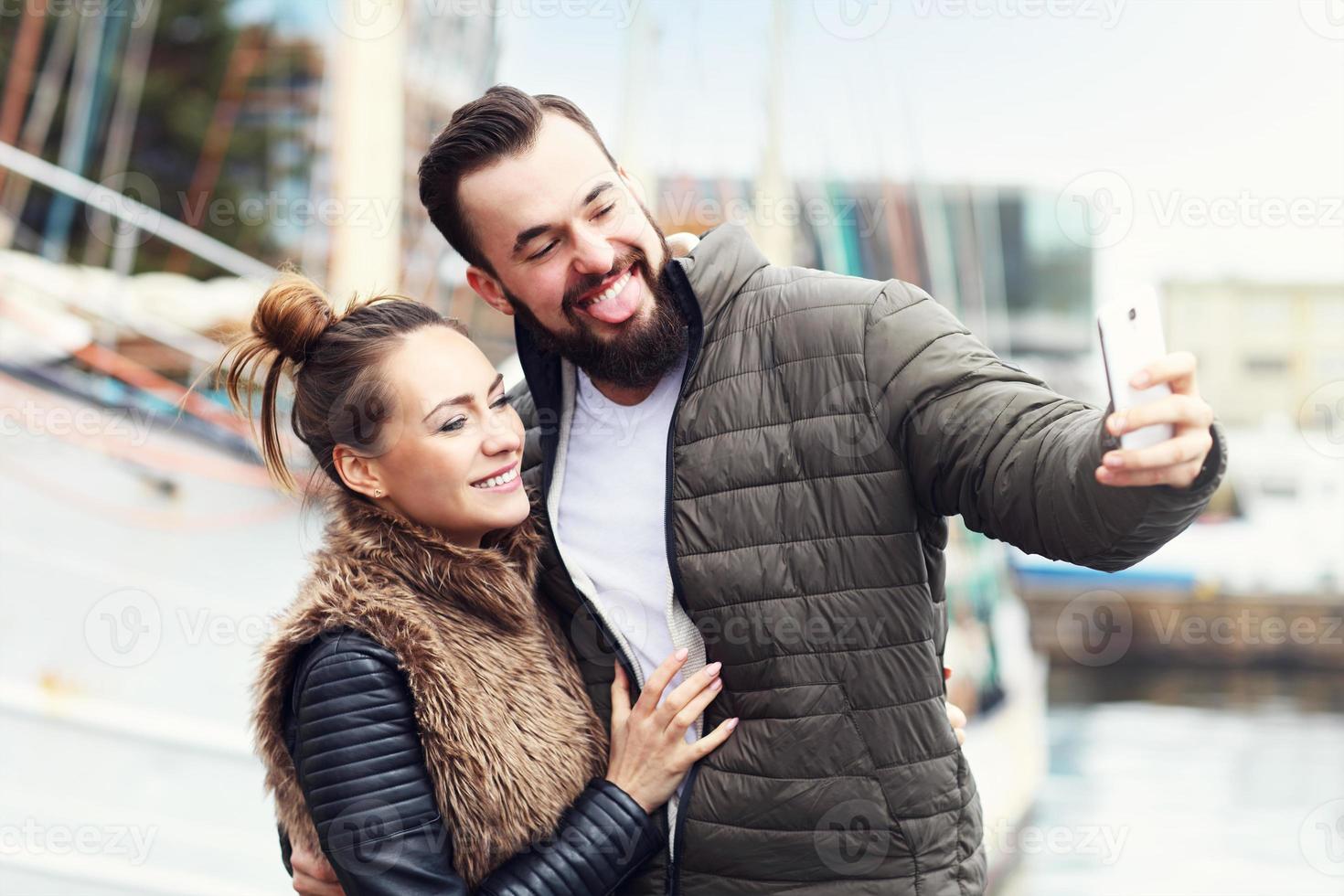 Young couple taking selfie photo